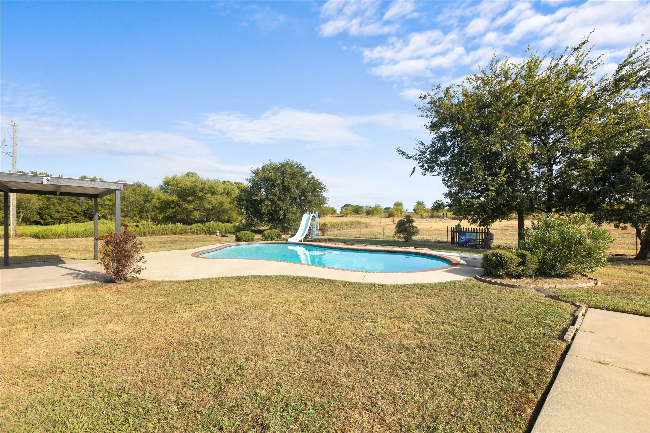 The pool’s built-in slide brings an extra dose of fun to backyard days and creates a space everyone will want to enjoy.