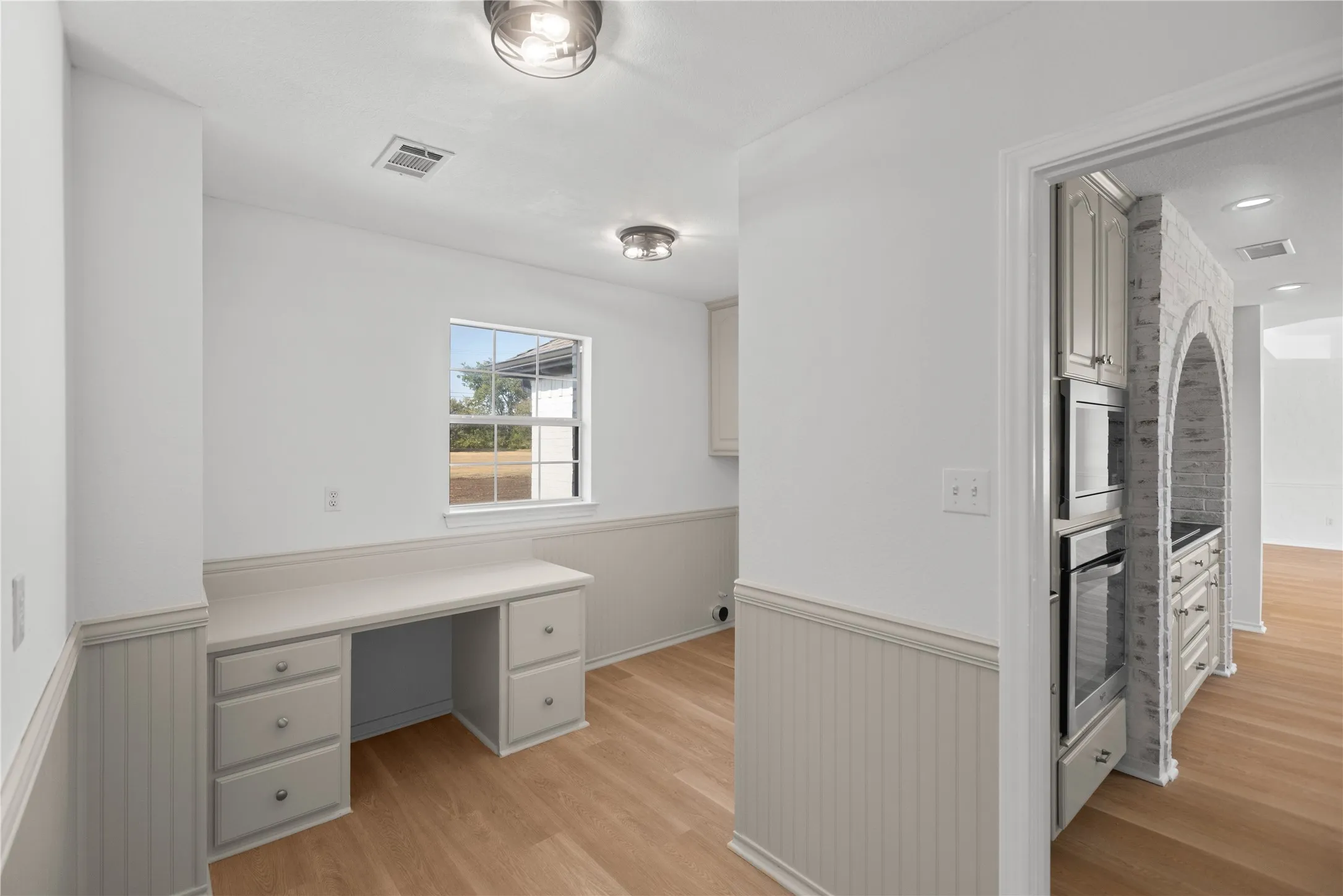 More than just a laundry room.. the dedicated desk creates the perfect spot for a home office, homework, organizing, or household planning.