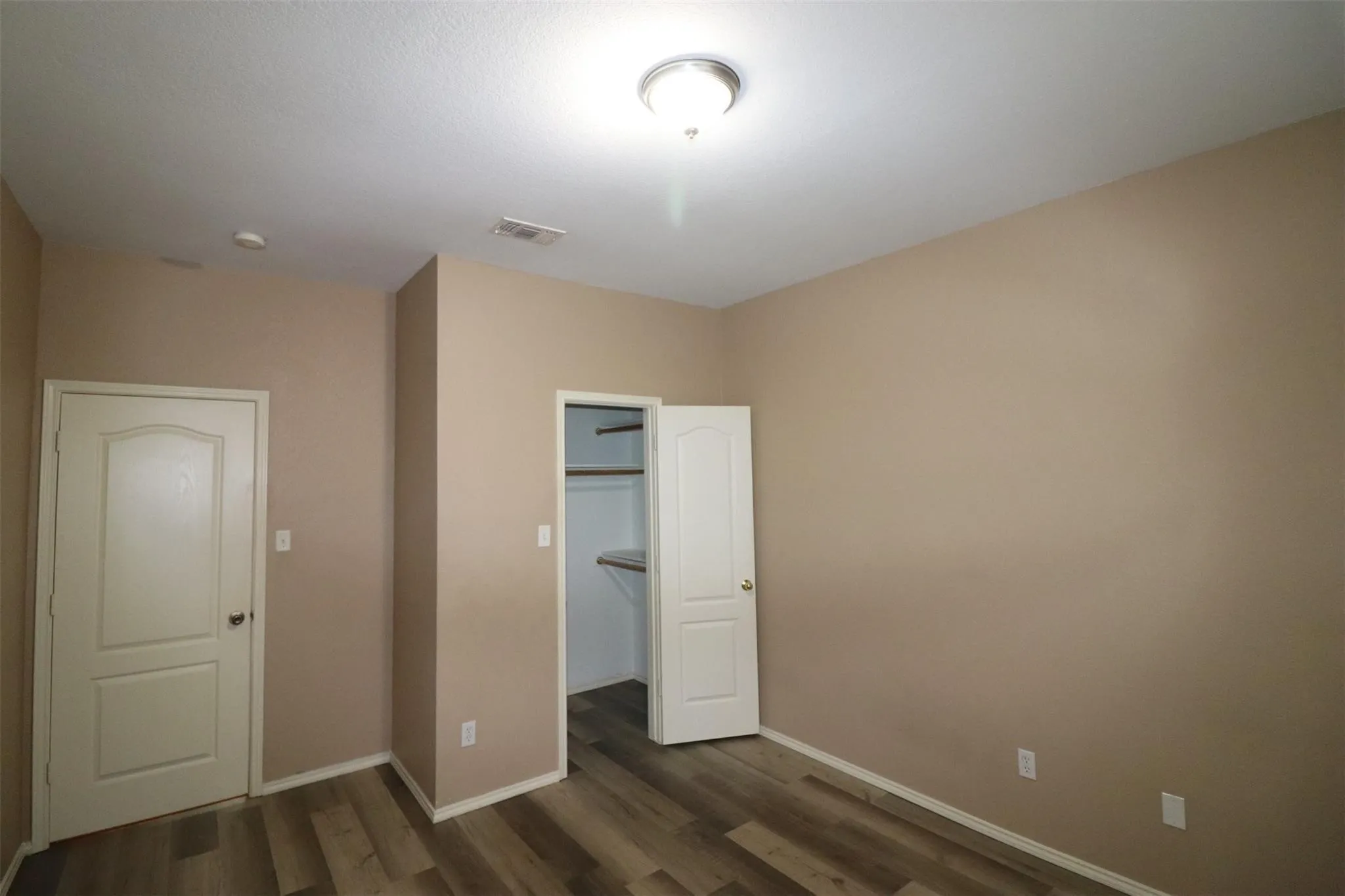 Wood-finish flooring with light-toned walls