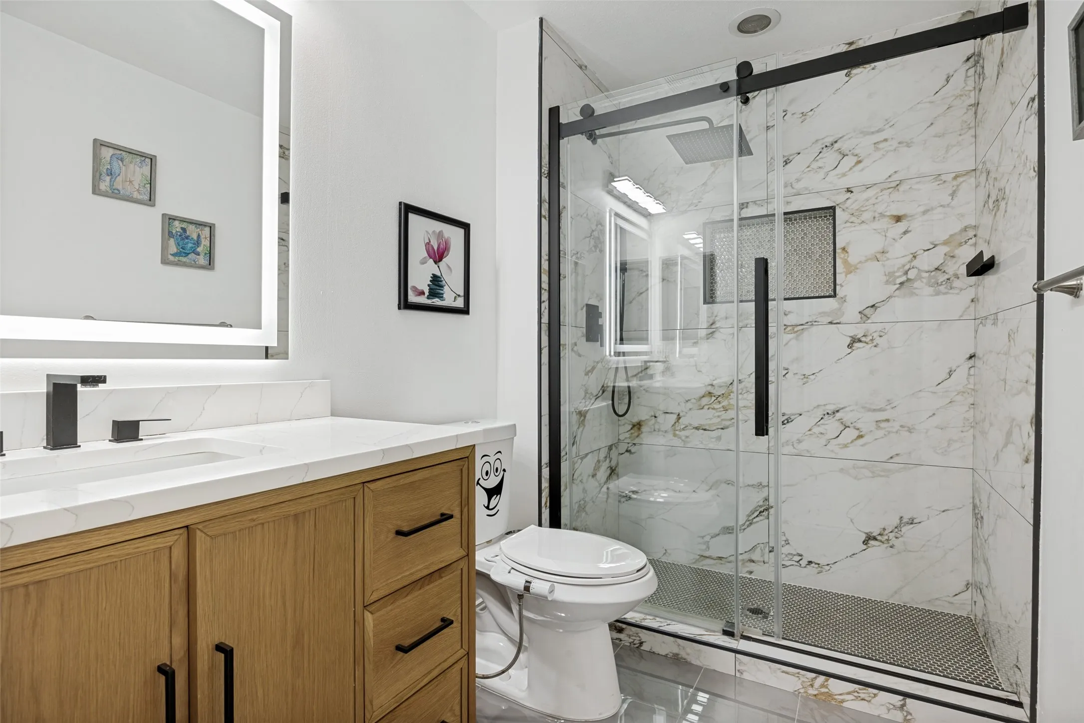 Wood-finish vanity with a white countertop and rectangular undermount sink