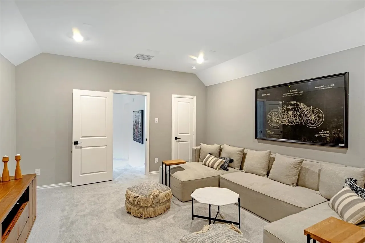 Vaulted ceiling featuring recessed lighting, light gray wall paint, and light gray carpeting