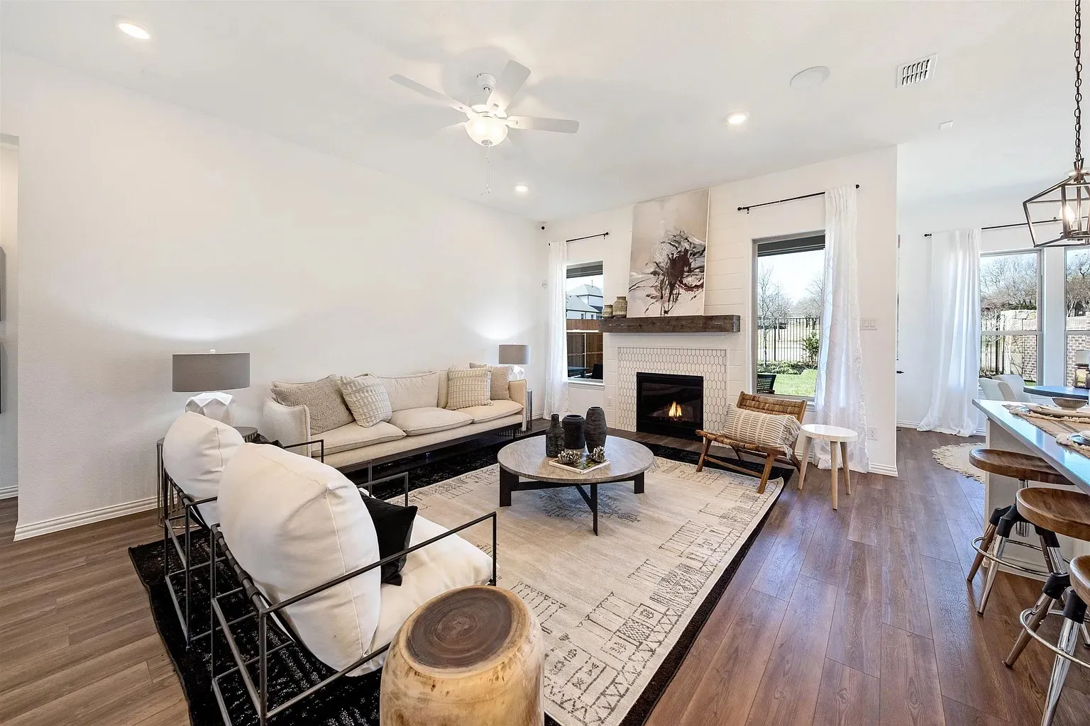 Wood-finish flooring throughout, recessed lighting, and a ceiling fan