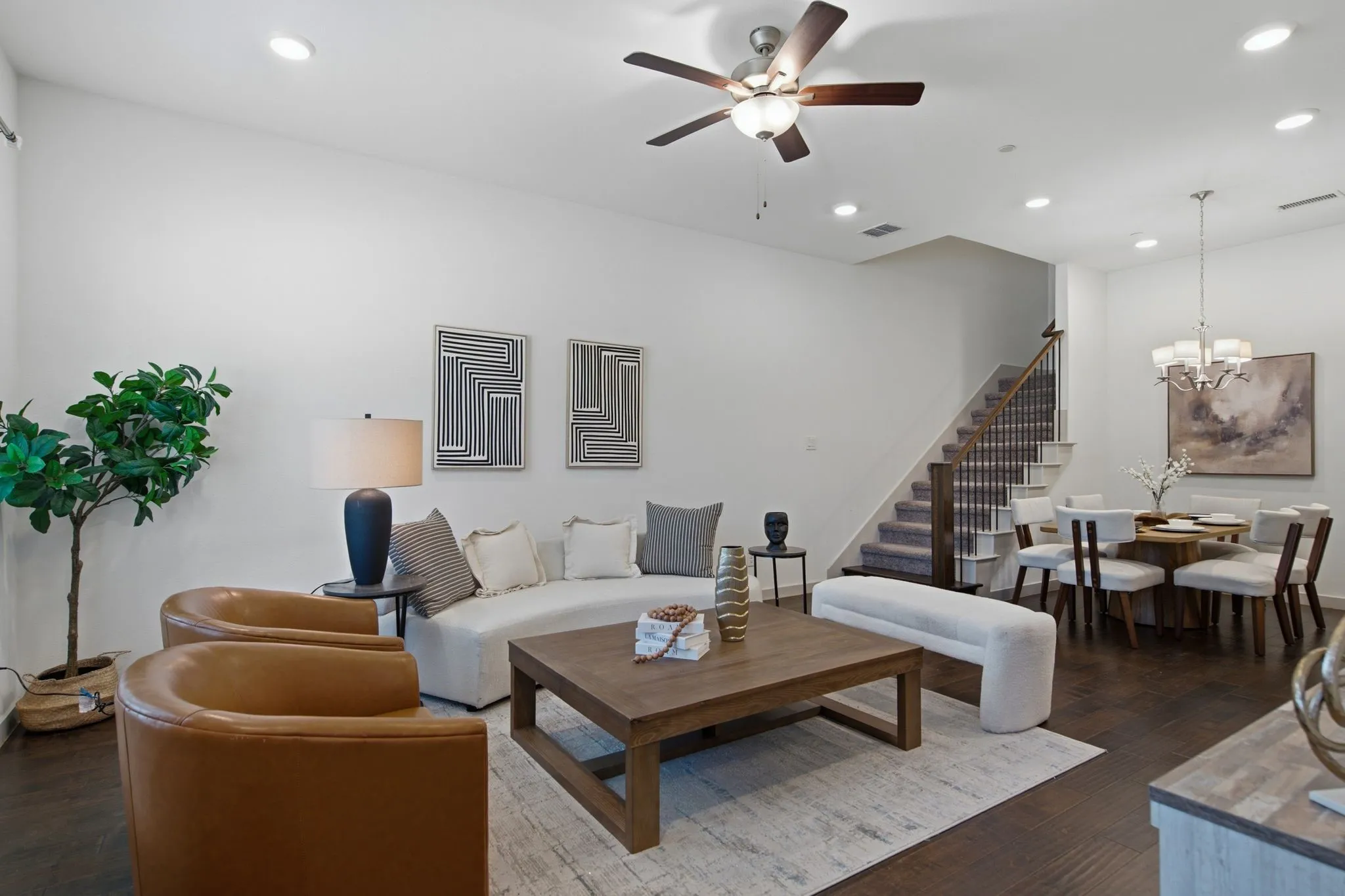 Open-concept living space featuring recessed lighting and dark wood-finish flooring