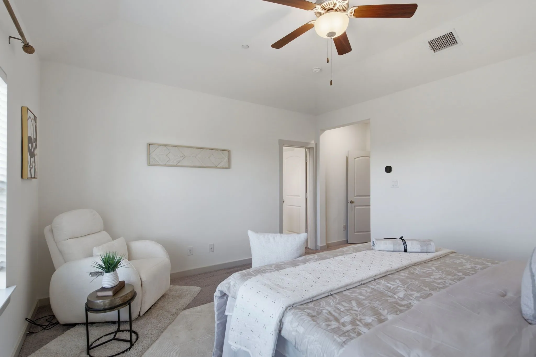 Spacious room featuring light-colored walls, recessed lighting, a ceiling fan with light fixture, and carpet flooring