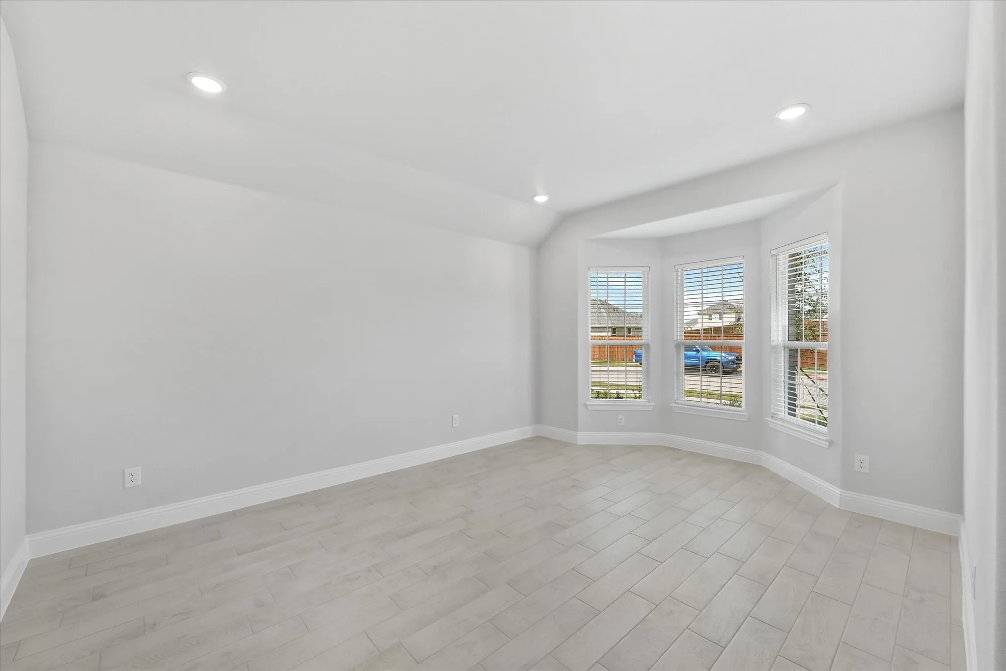 Spare room with light wood-type flooring