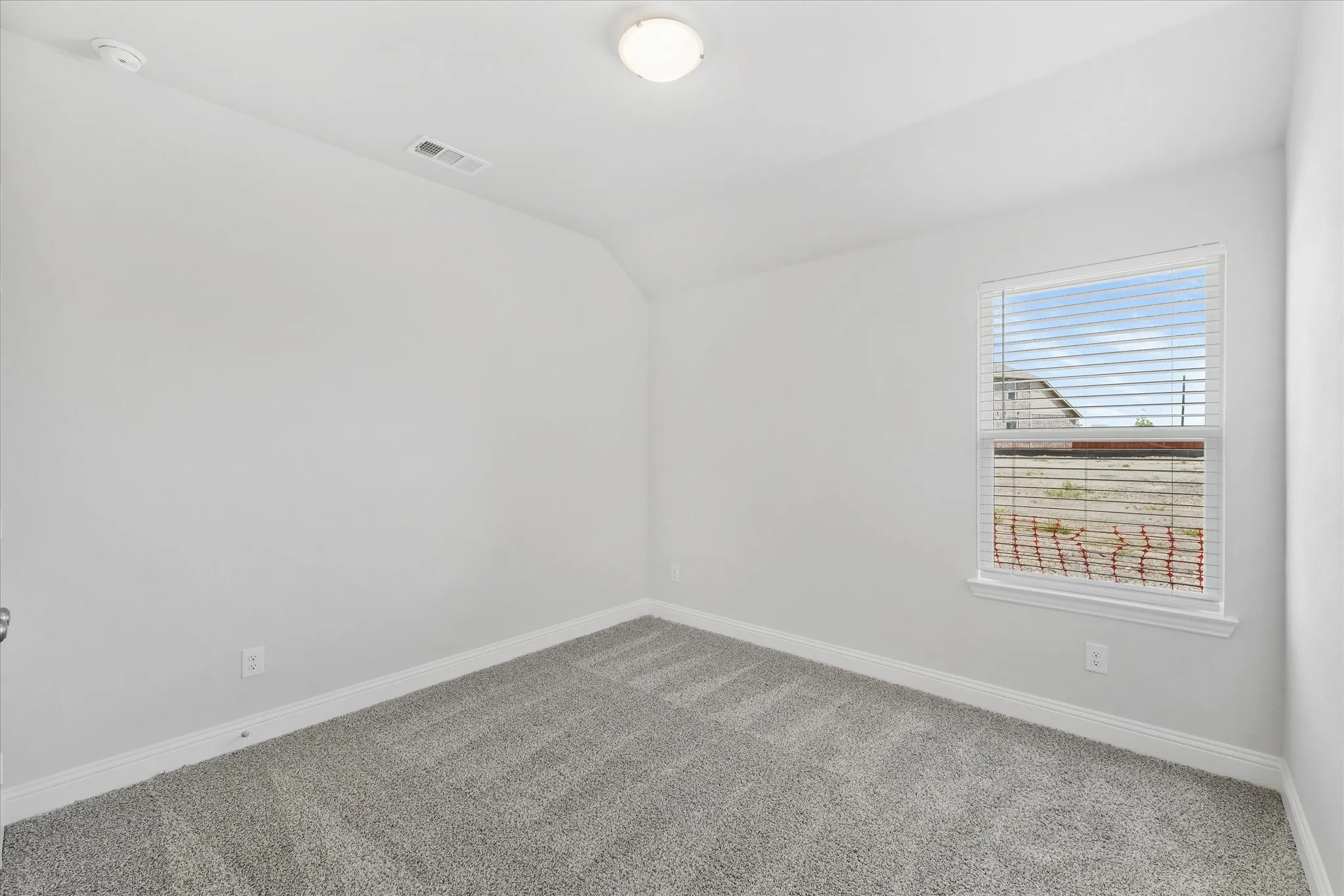 Empty room featuring carpet flooring