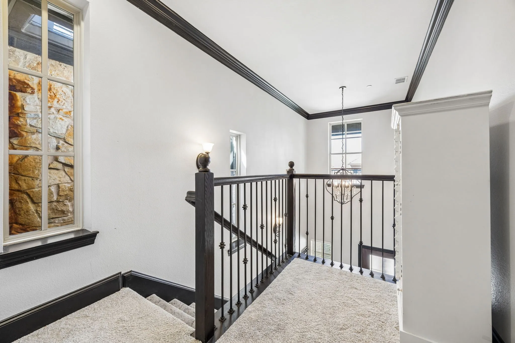 Landking upstairs that can be used as desk space or book cases or reading space