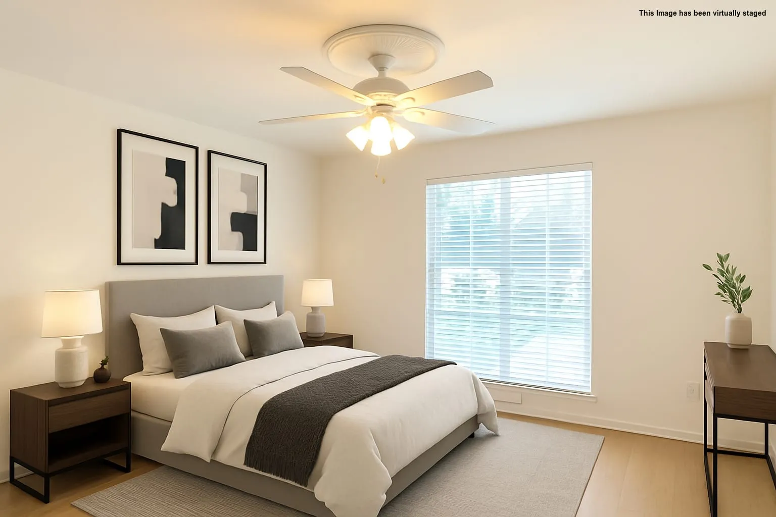 Bedroom with light wood-style flooring and ceiling fan