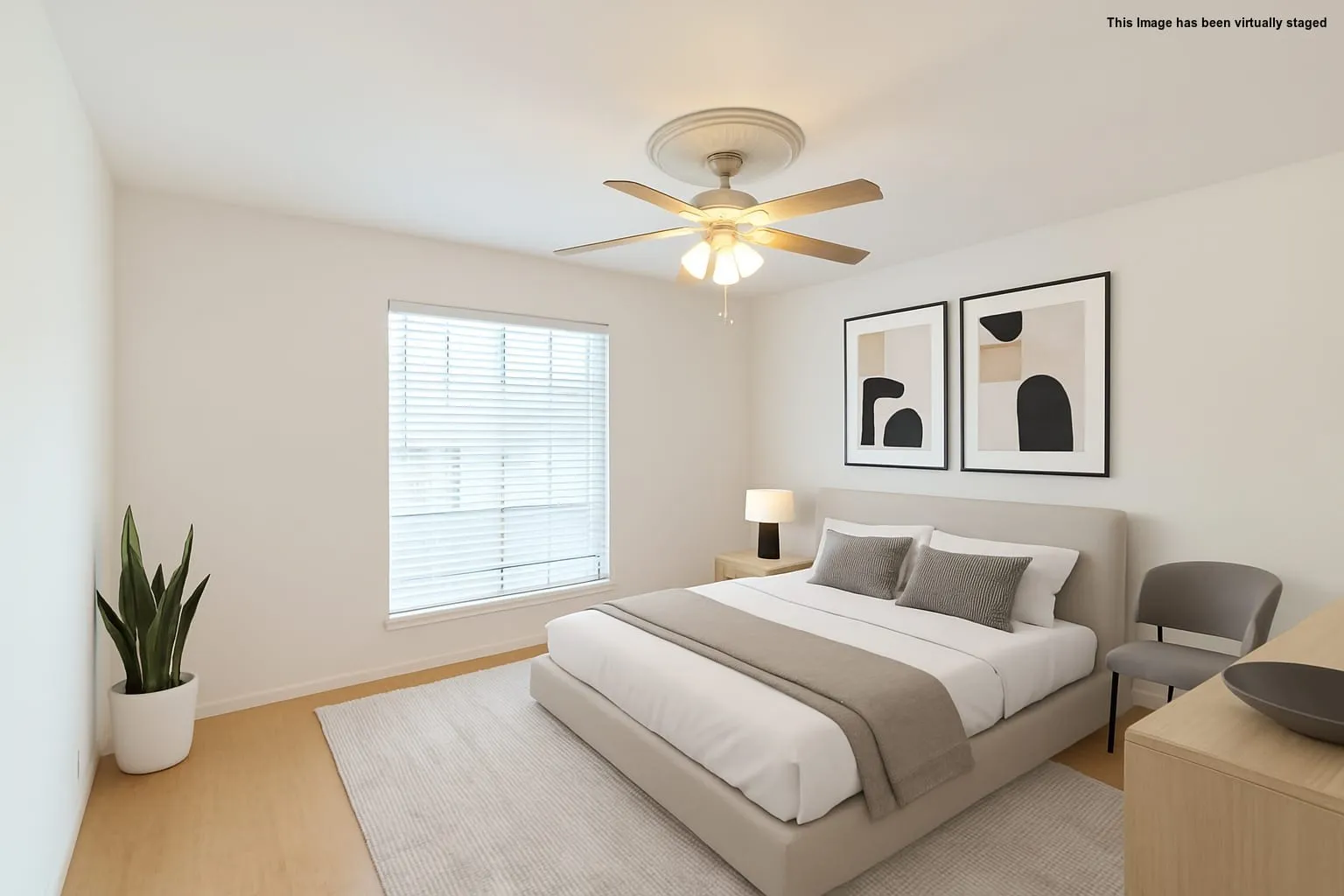 Bedroom with wood finished floors and ceiling fan