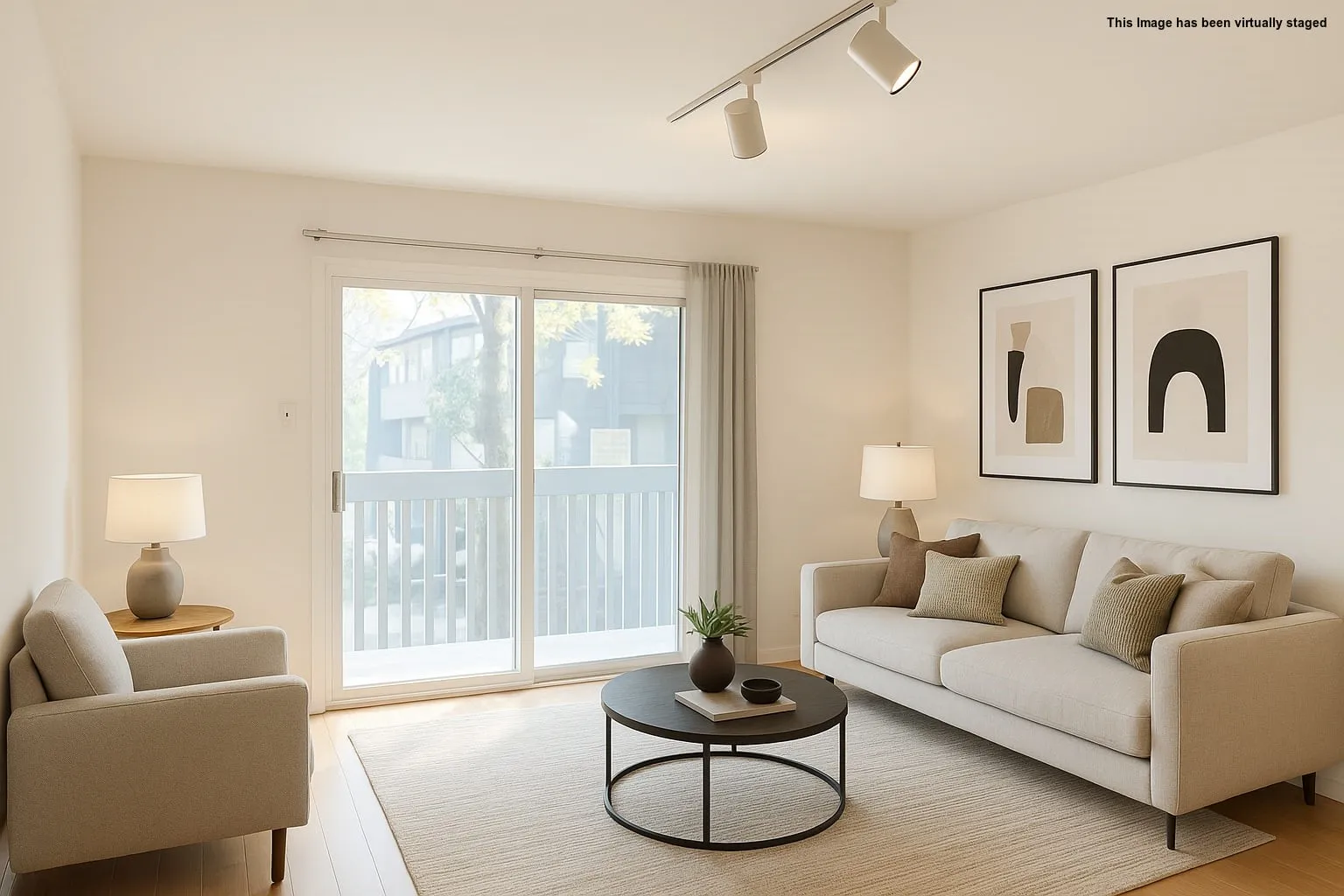 Living room featuring track lighting and light wood-style flooring