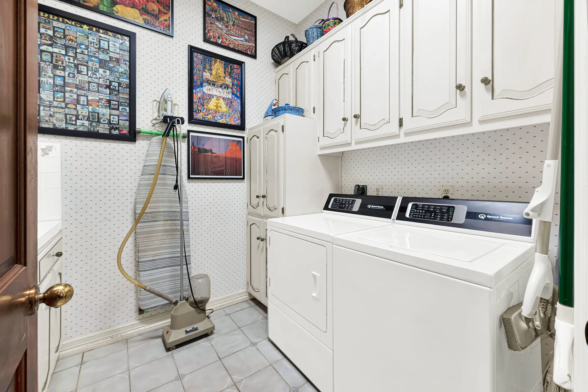 Laundry room just off of the kitchen. Space for full size w/d. Sink and built in cabinets to the left (not in the image)