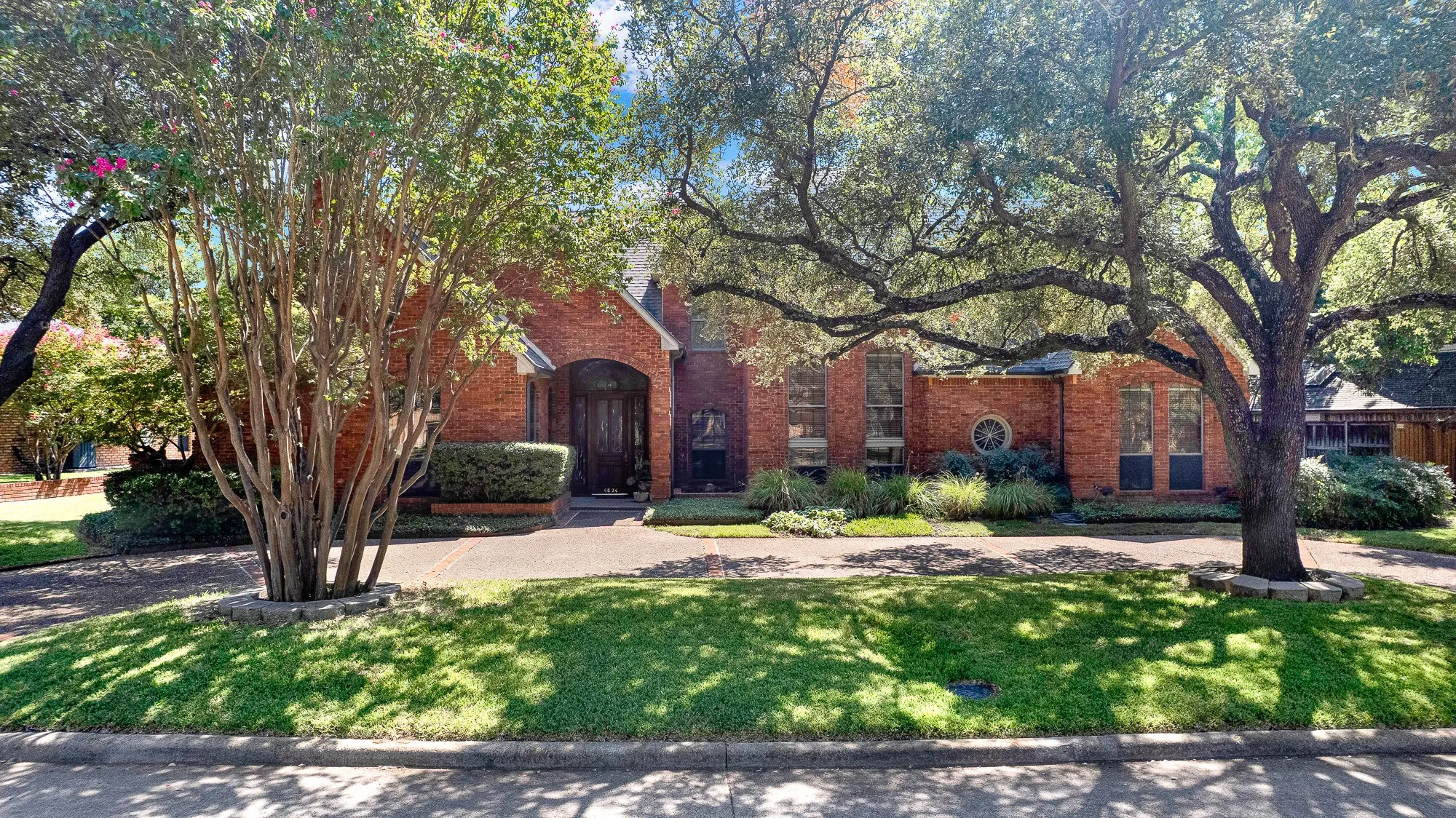 View from the street. Circular drive makes coming and going great for you and your friends.