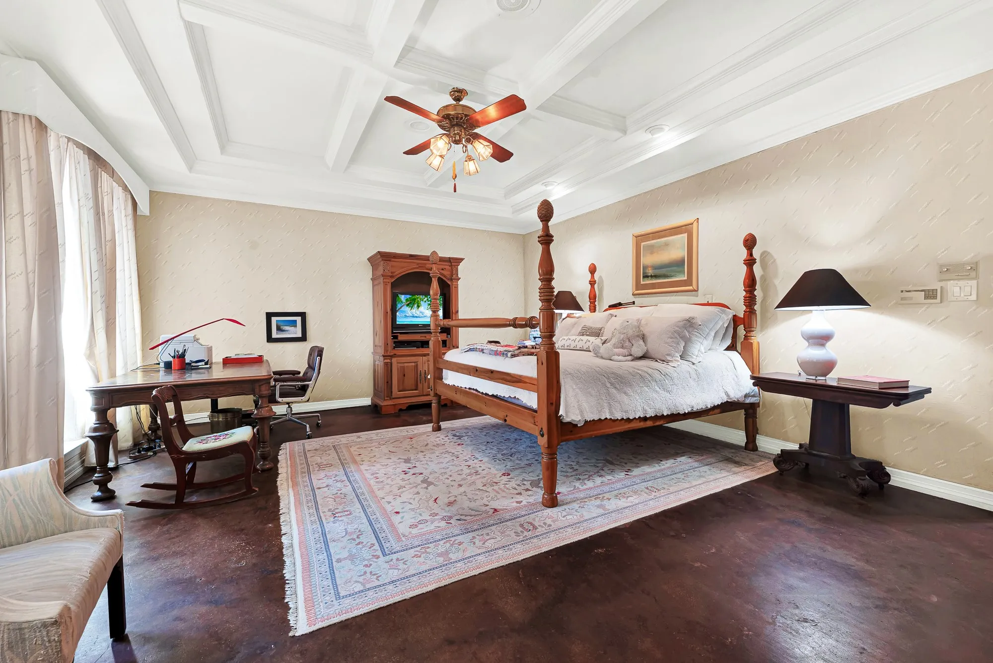 Notice the large bedroom with cement floor and custom coffered ceiling