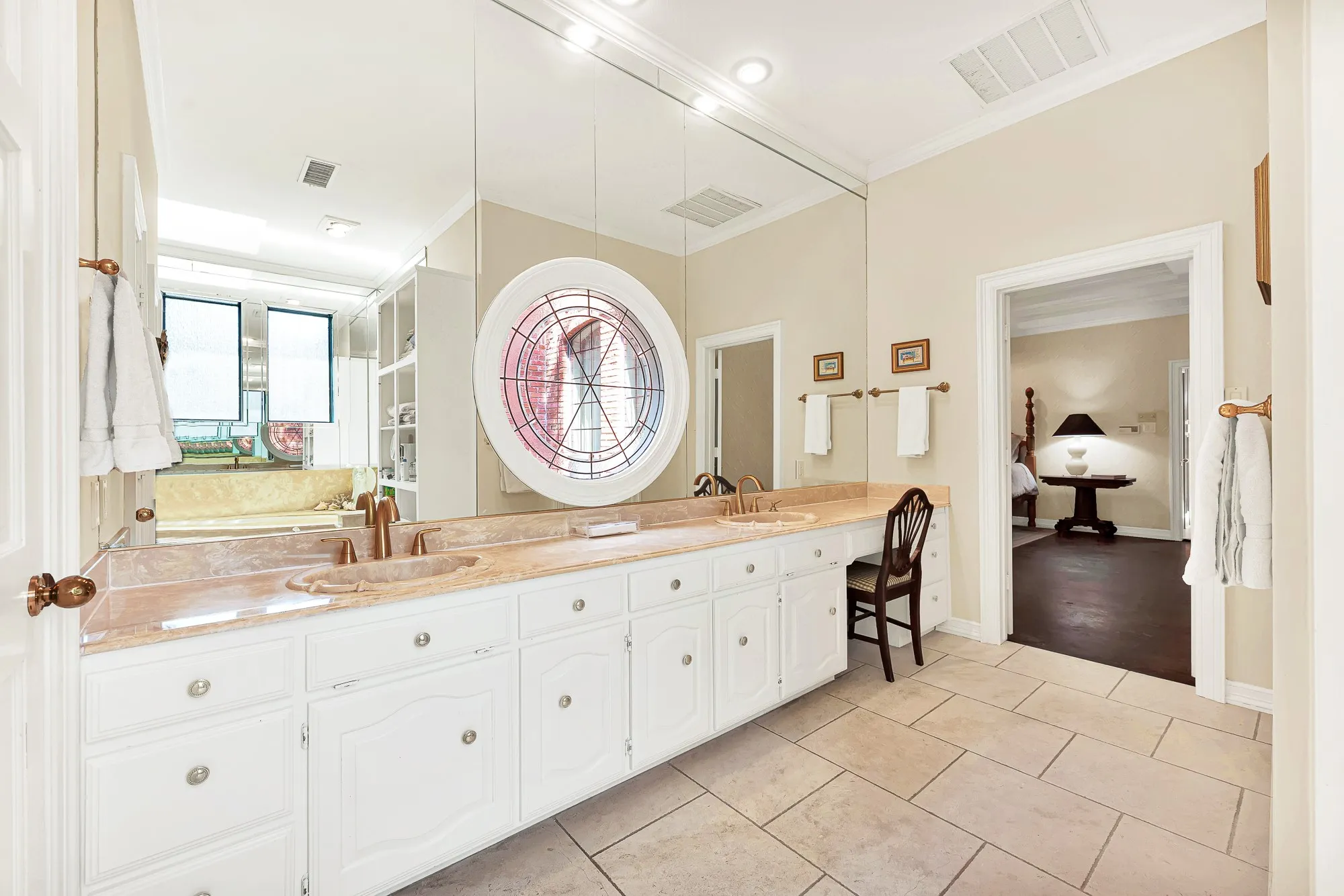 Large bathroom with two closets, jetted garden tub, and separate shower