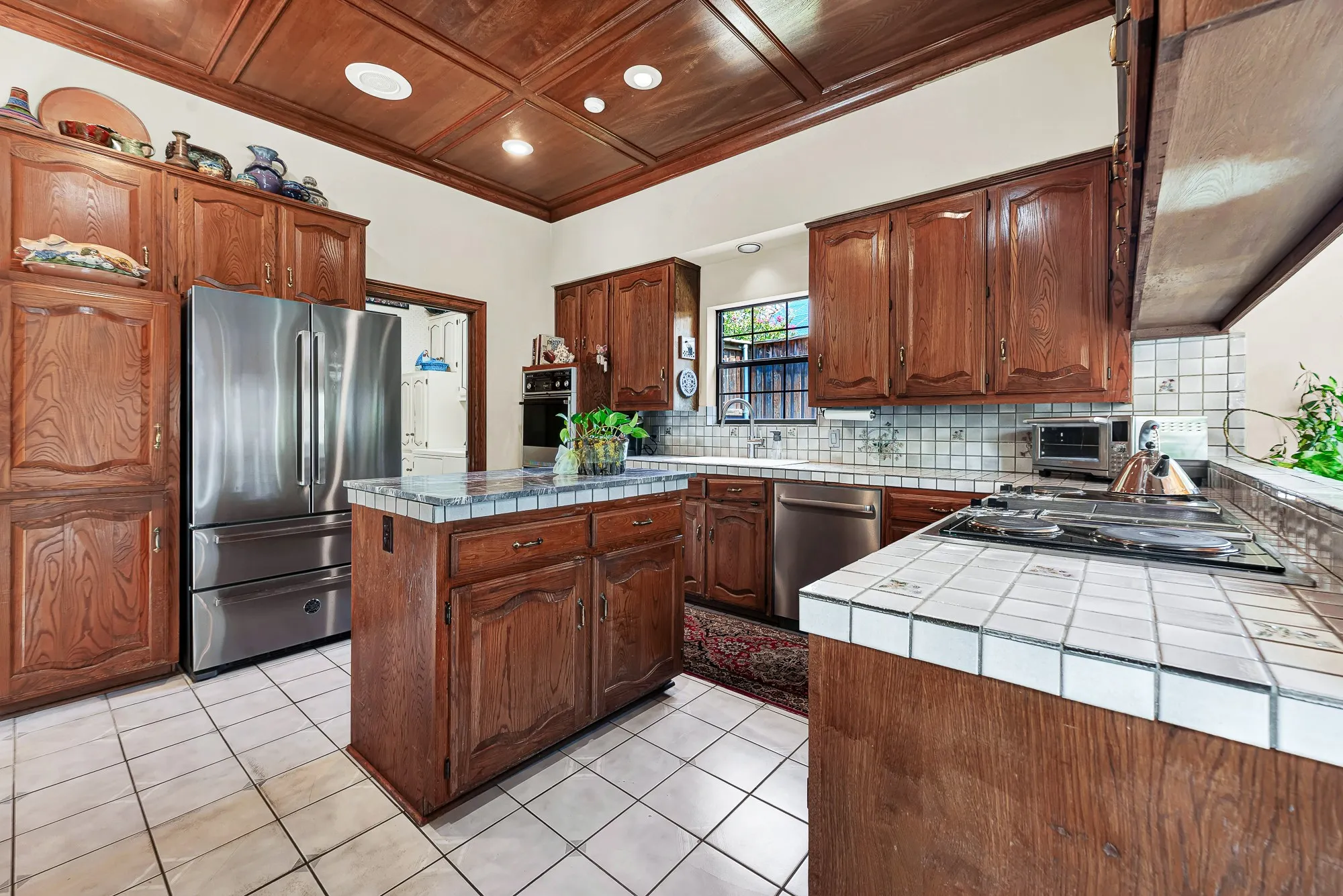 Beautifully wood crafted cabinets and architectural designed wood ceilings