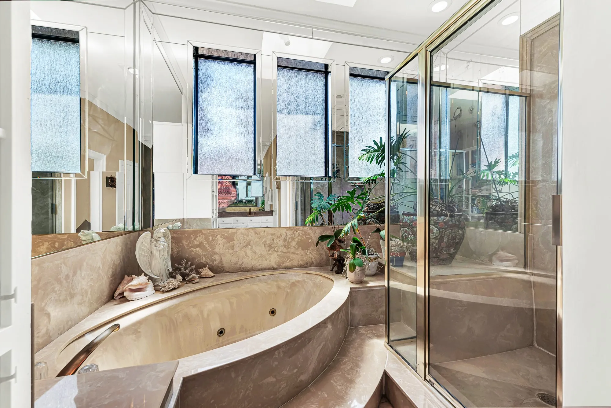 Large bathroom offering a jetted garden tub and separate shower