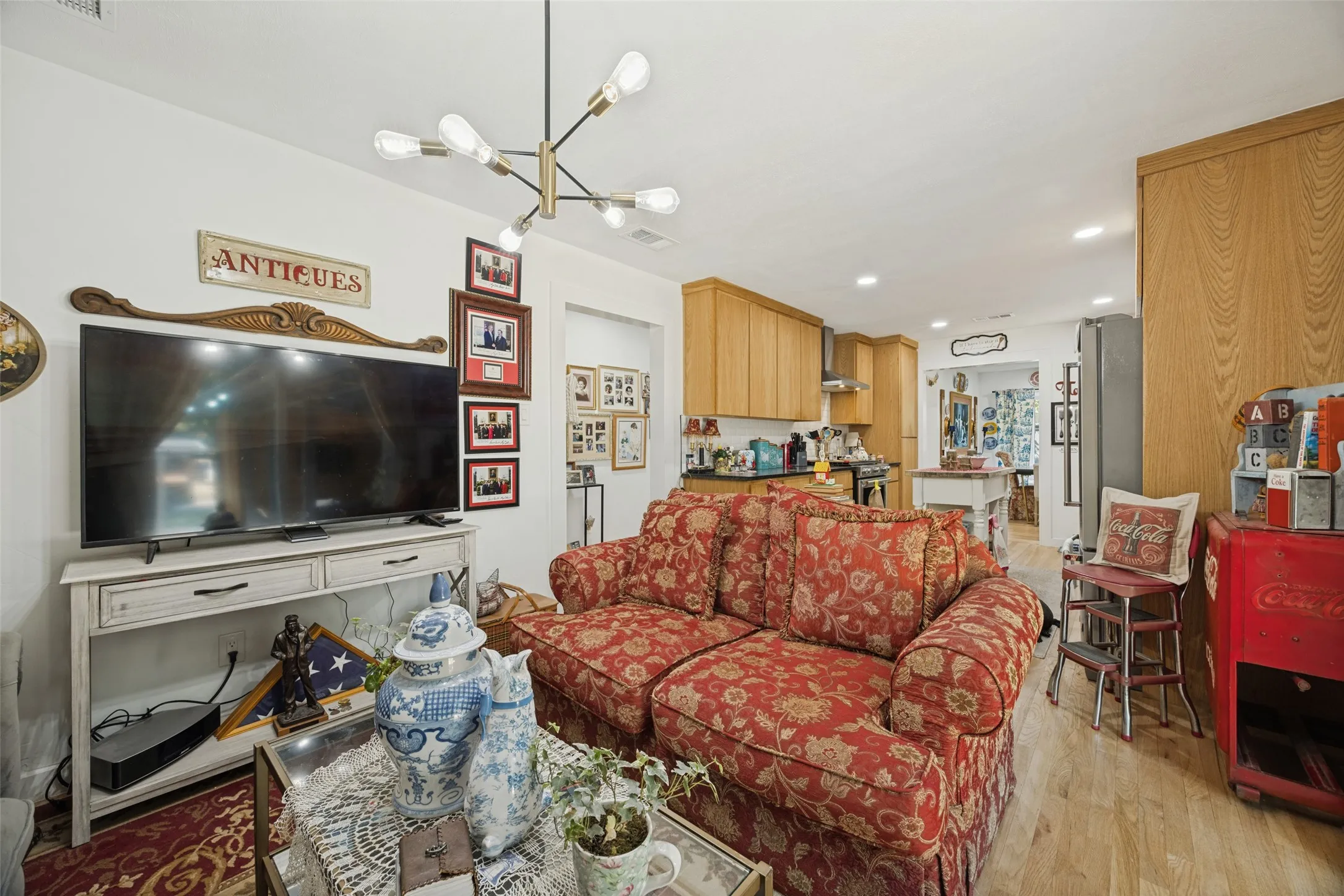 Open-concept living area with wood-finish flooring