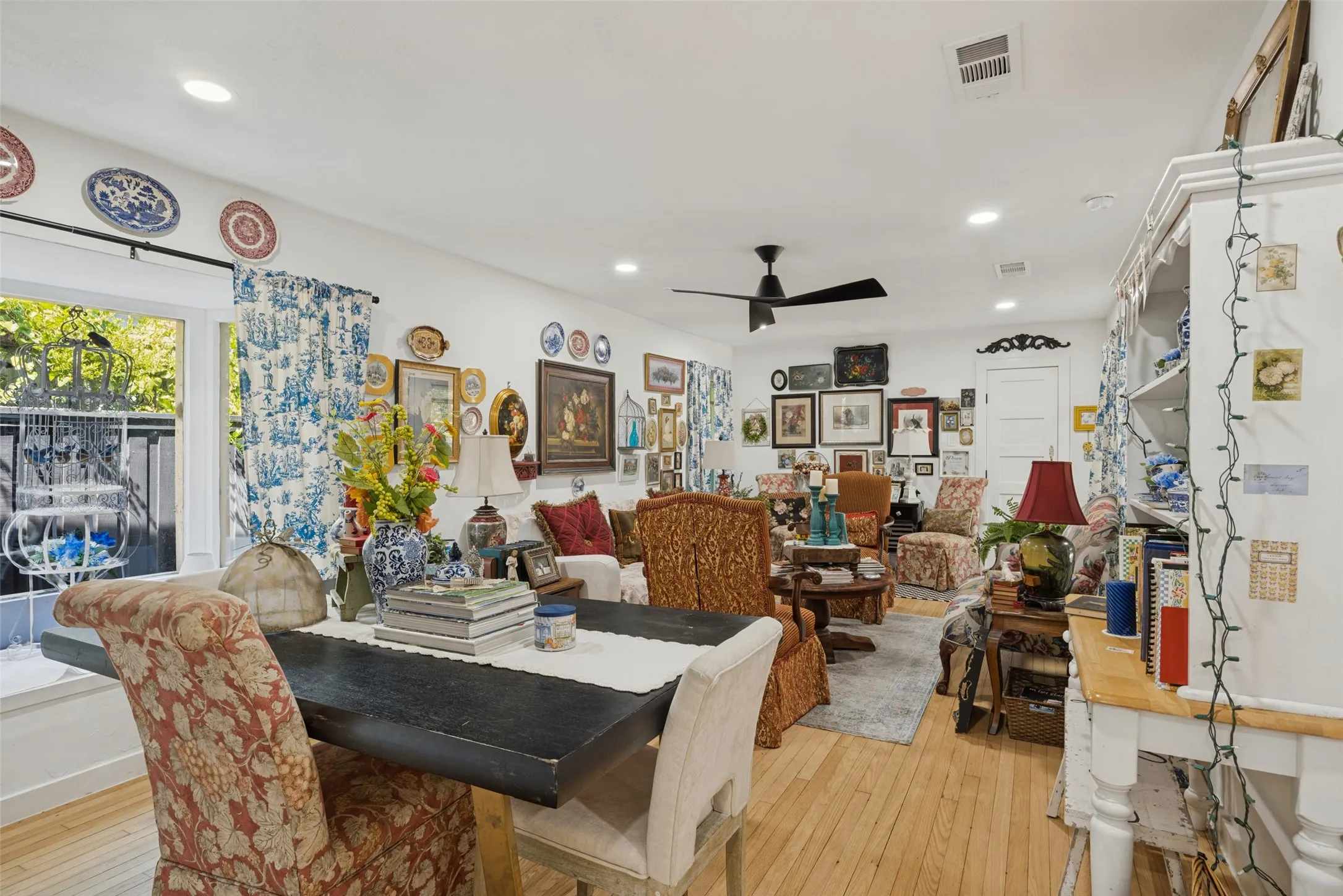 Recessed lighting, wood-finish flooring, and a ceiling fan