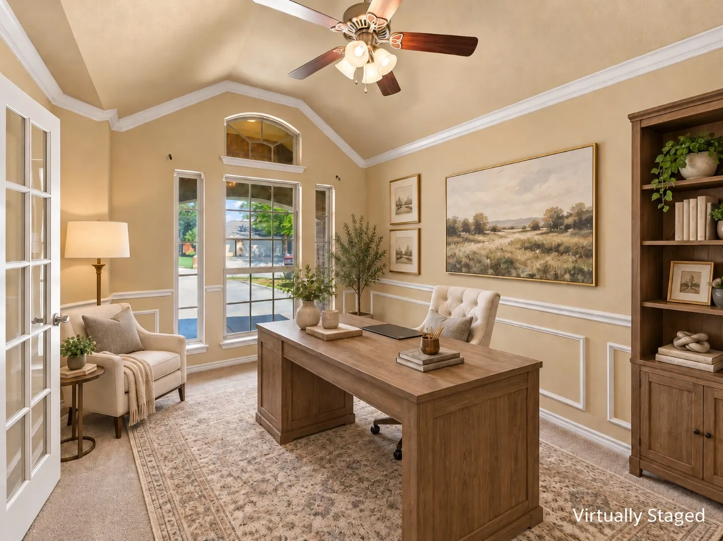 Vaulted ceiling, crown molding, French doors, extensive window array, and a ceiling fan