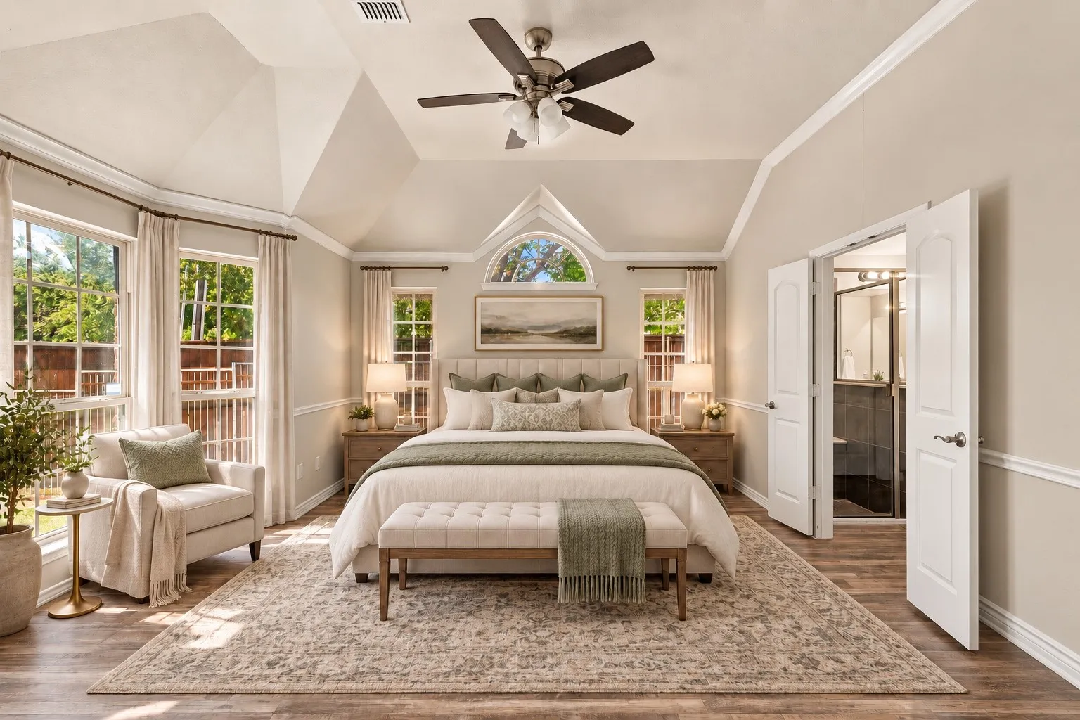 Vaulted ceiling with crown molding and ceiling fan