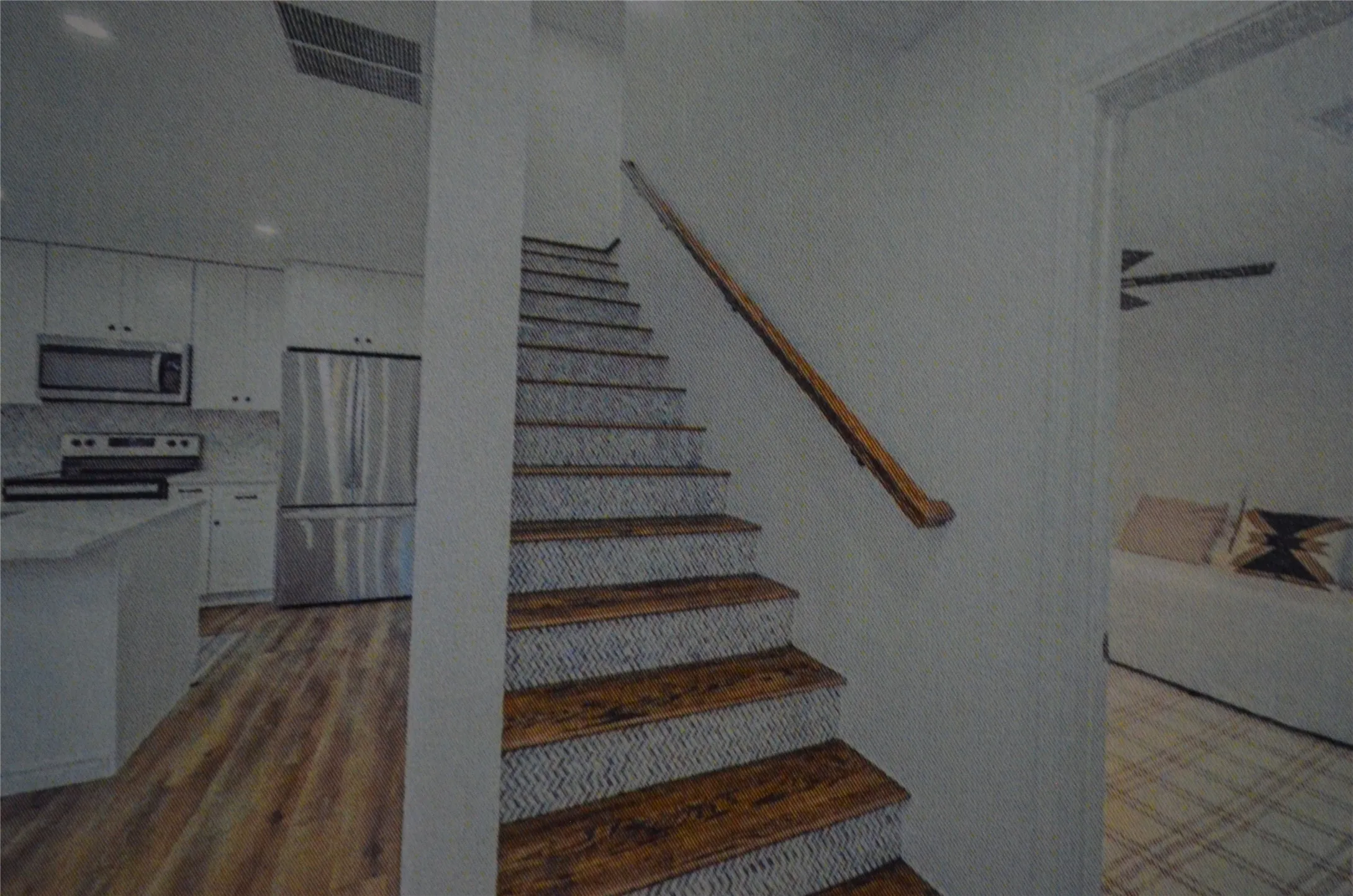 Staircase with wood treads and patterned risers, wood handrail, recessed lighting, and wood-finish flooring.
Storage underneath stairs.
