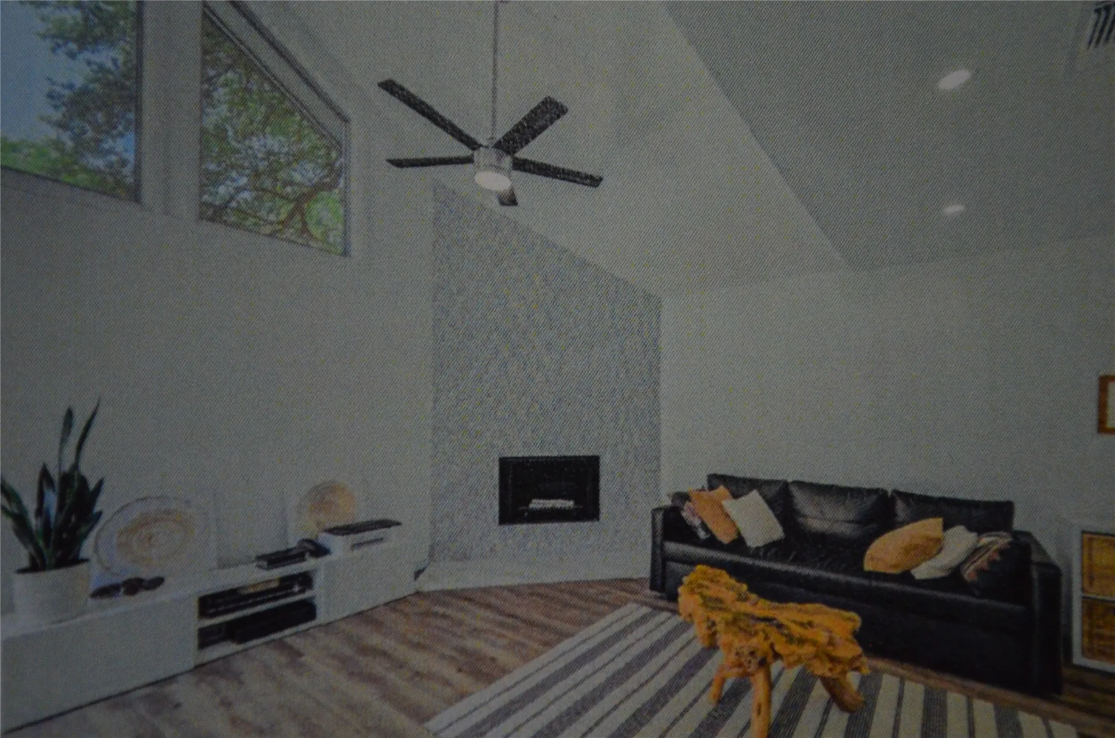 Vaulted ceilings with recessed lighting, wood-finish flooring, and a textured fireplace surround featuring a built-in fireplace