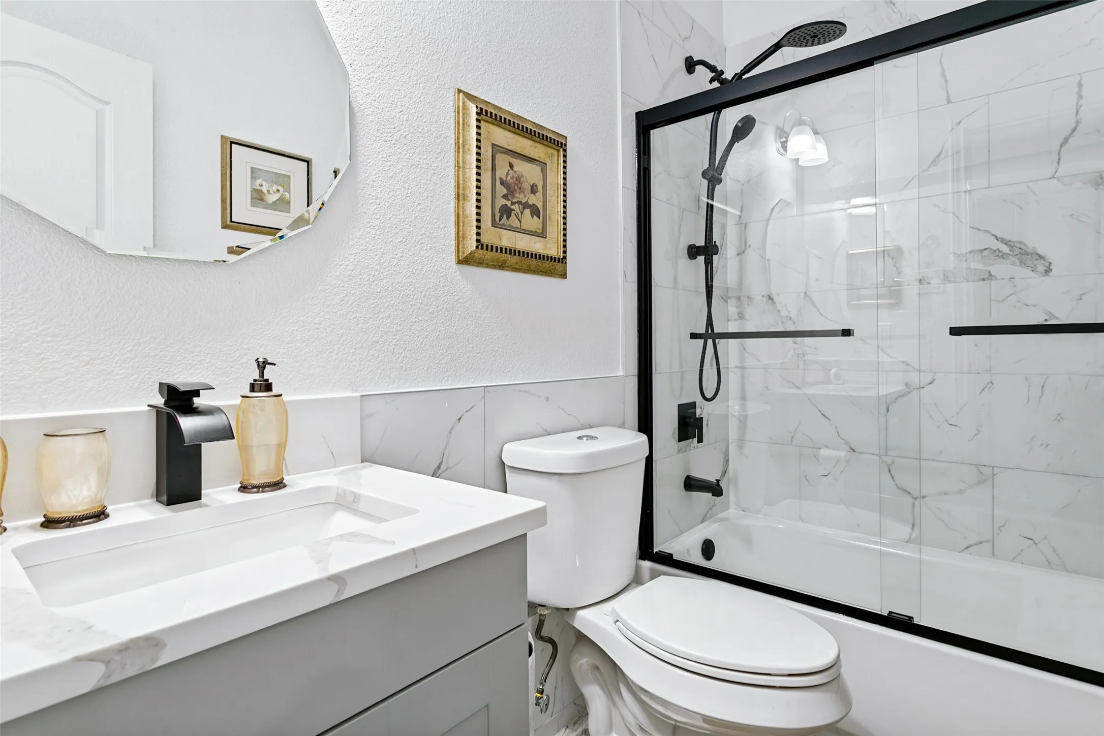 Vanity with integrated rectangular sink, matte black faucet, and engineered stone countertop