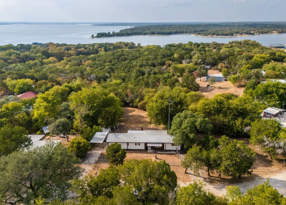 Waterfront property with extensive surrounding tree canopy