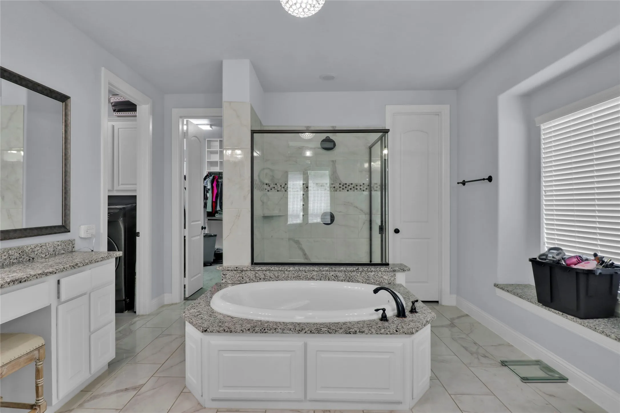 Garden tub with oversized separate shower.