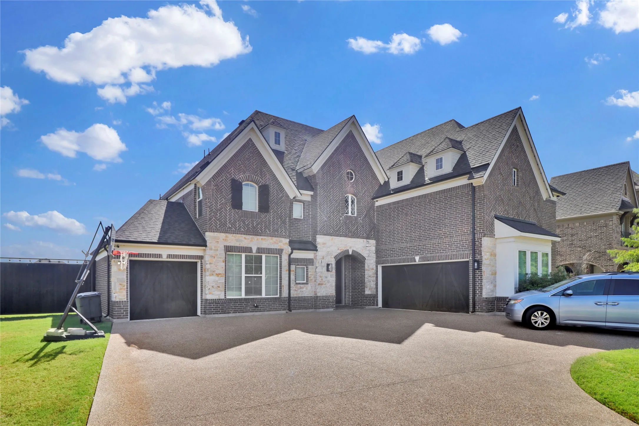 Corner lot and a 3rd car garage and extra paved parking space.