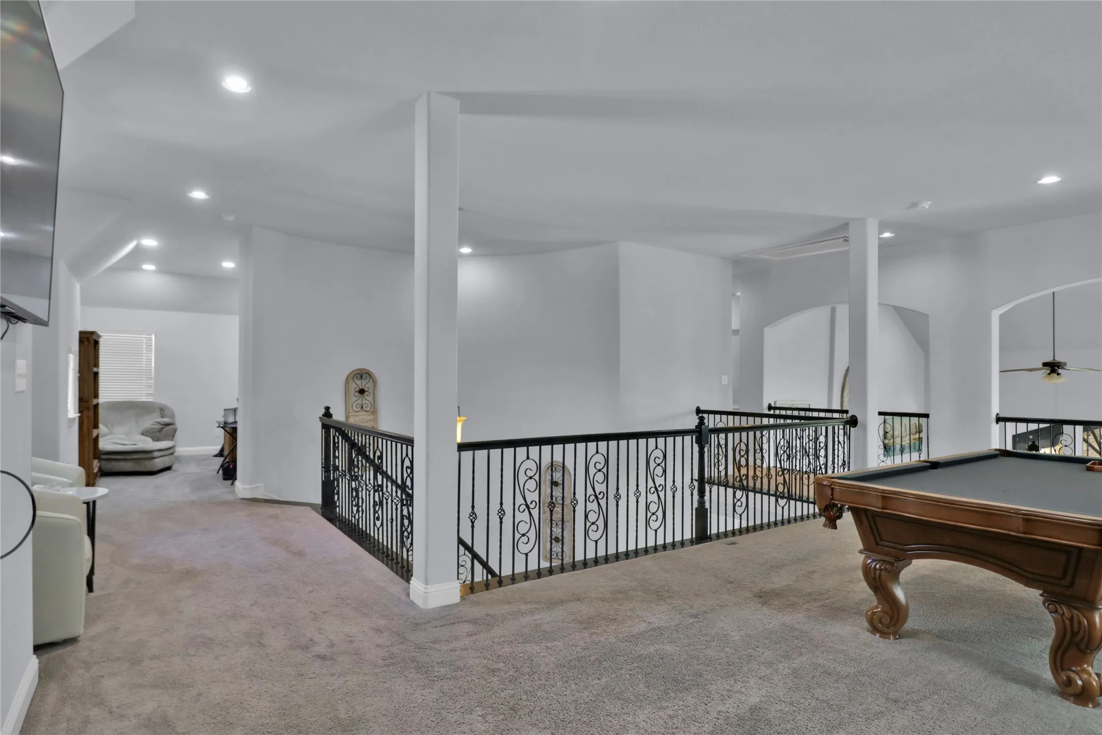 Room to left is a bonus room. Used as a second home office, it could be a gaming area, quiet reading space or workout space.