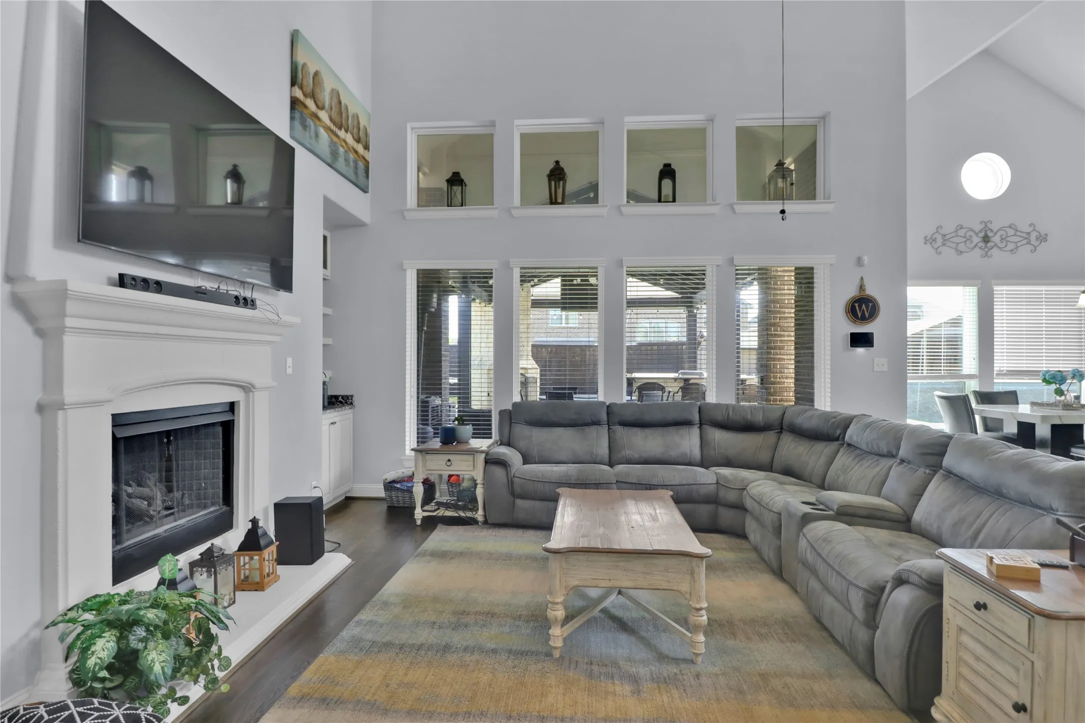 Living room with fireplace and lots of natural light.