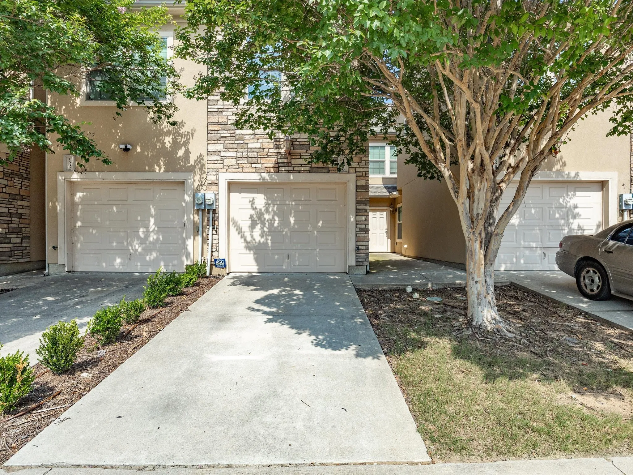 Exterior facade with stacked stone and stucco finishes
