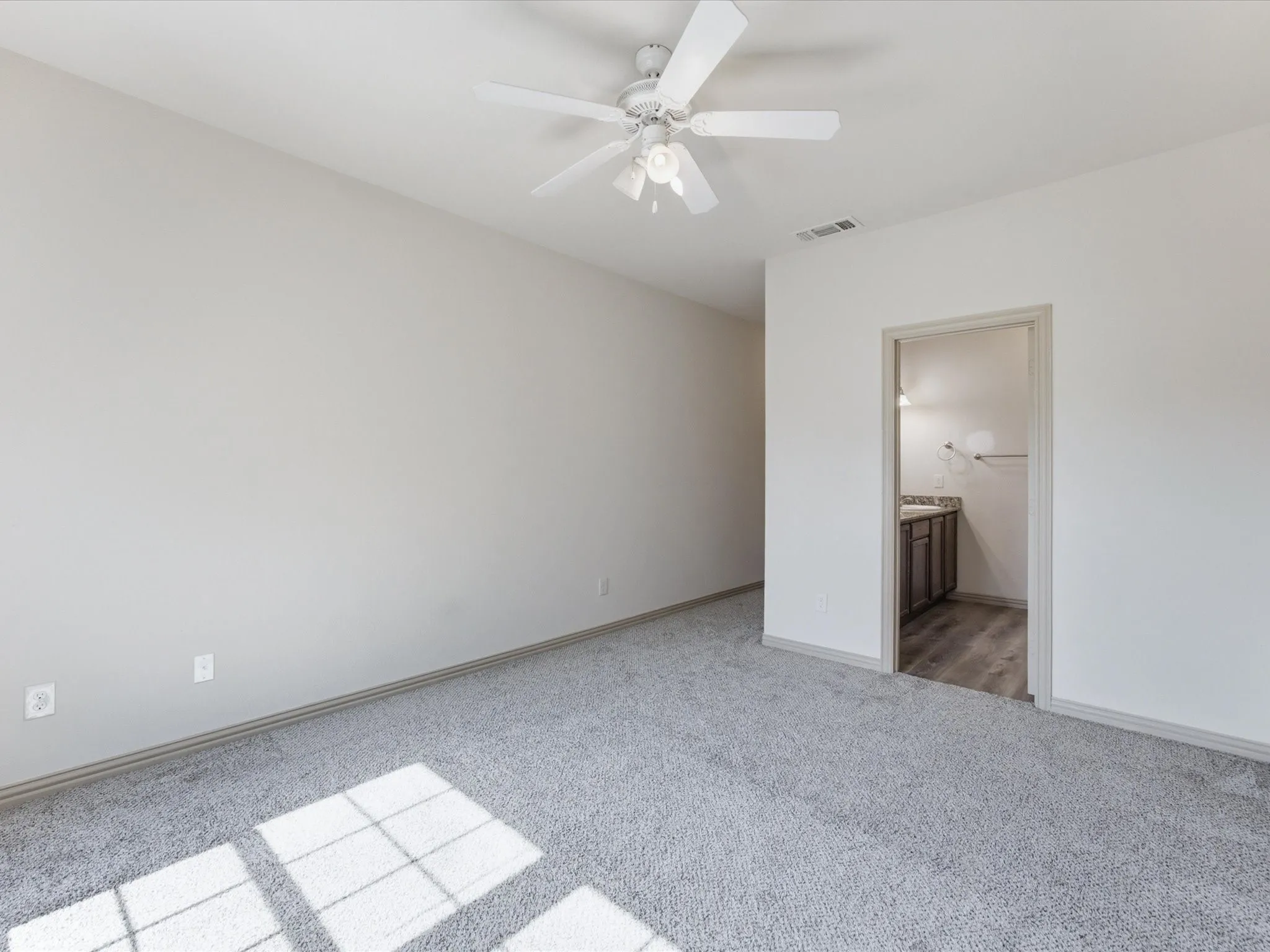 Light grey carpeting and light-toned walls