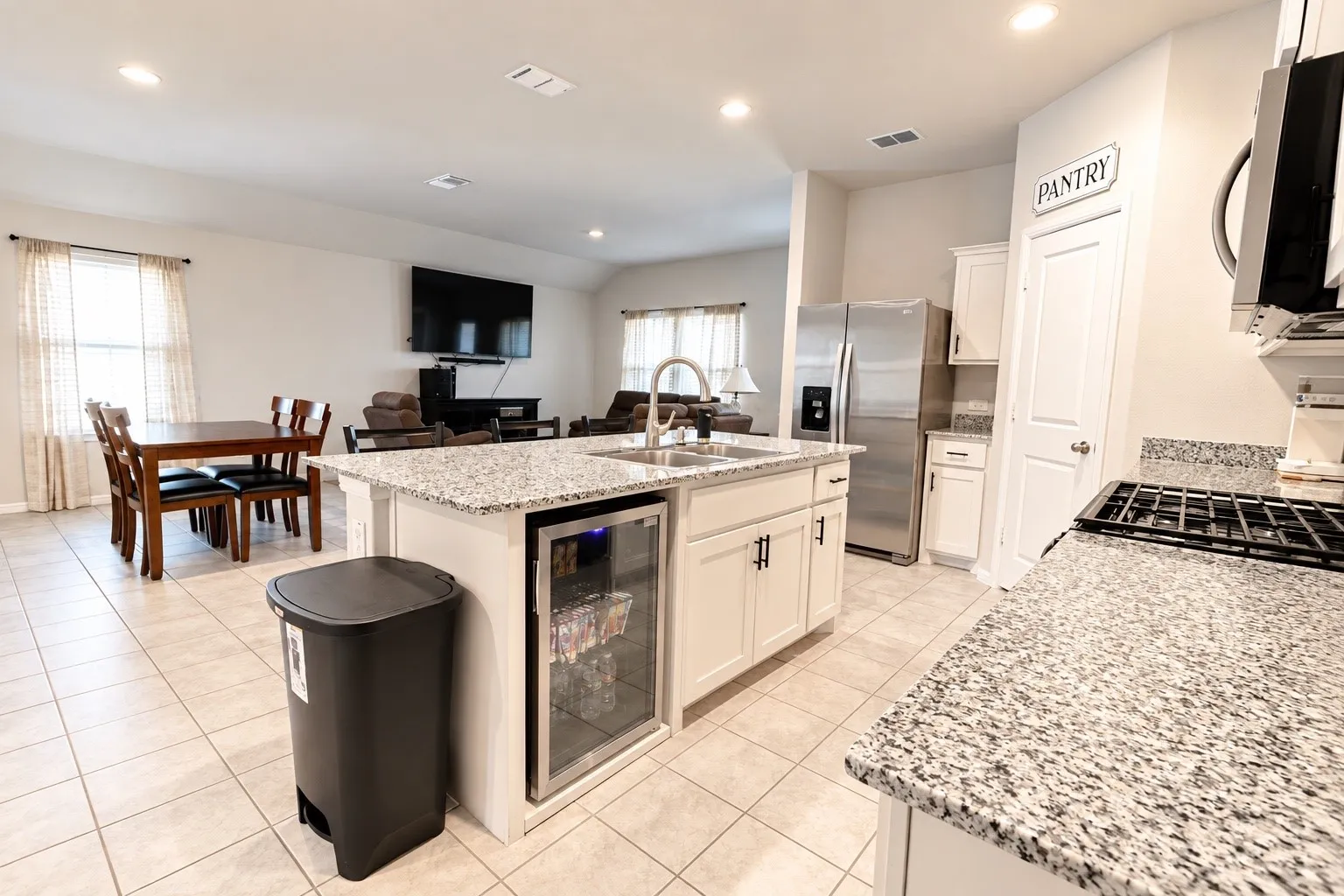 Spacious kitchen featuring granite countertops and tile flooring