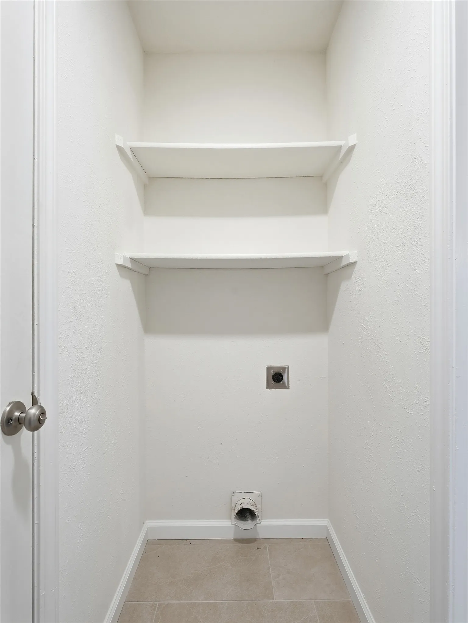 Built-in shelving for storage with tile flooring