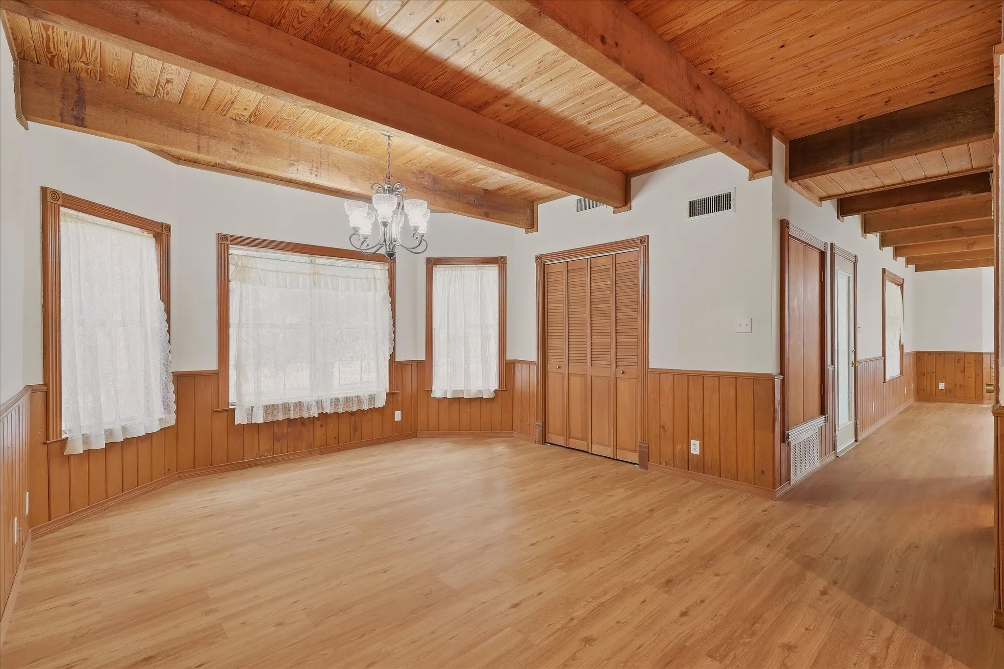 Dining area and laundry room, with hallway to the right leading to front door and living room.