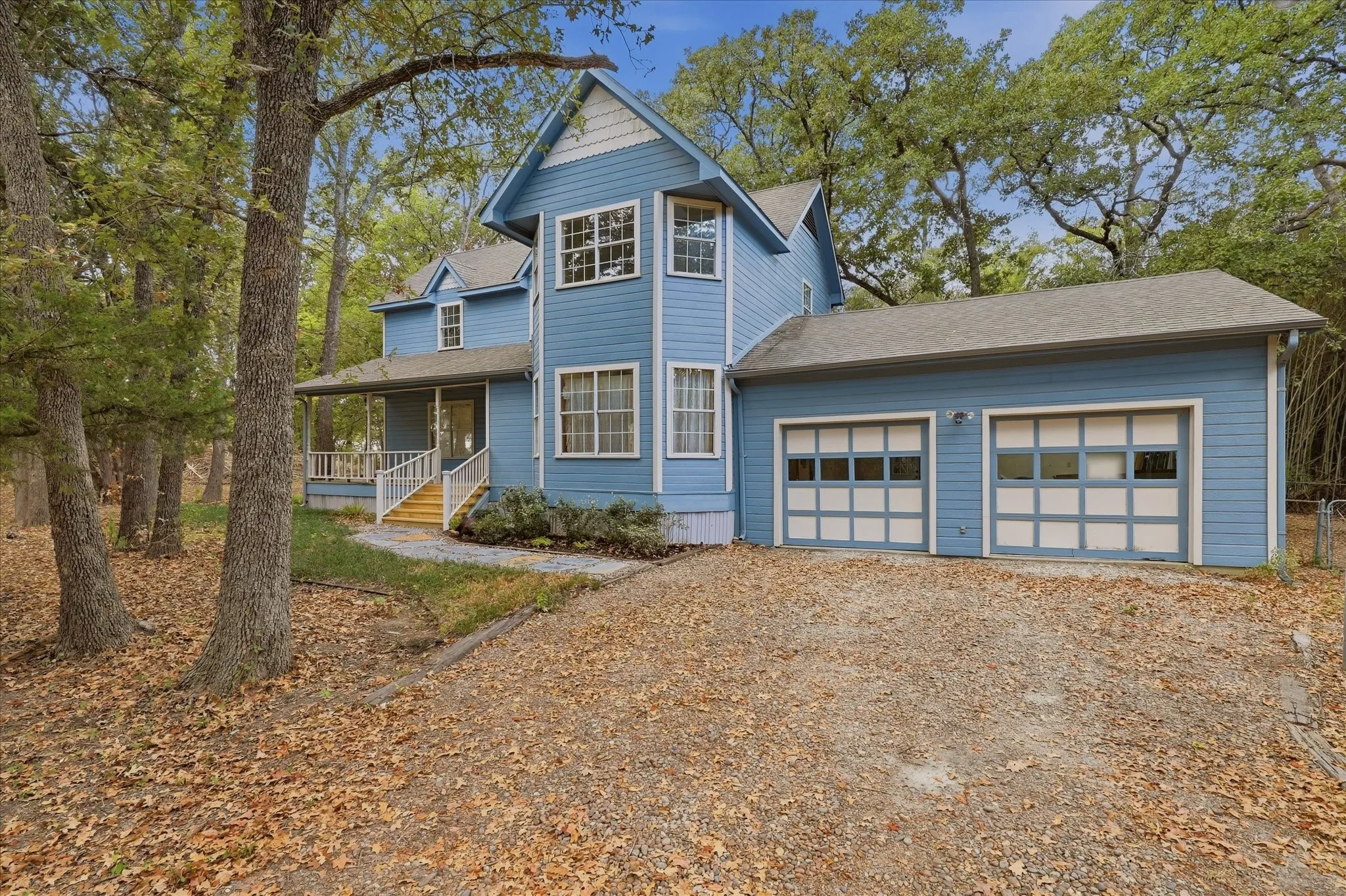 Tasteful landscaping and brand new flagstone pathway lead to the front porch.