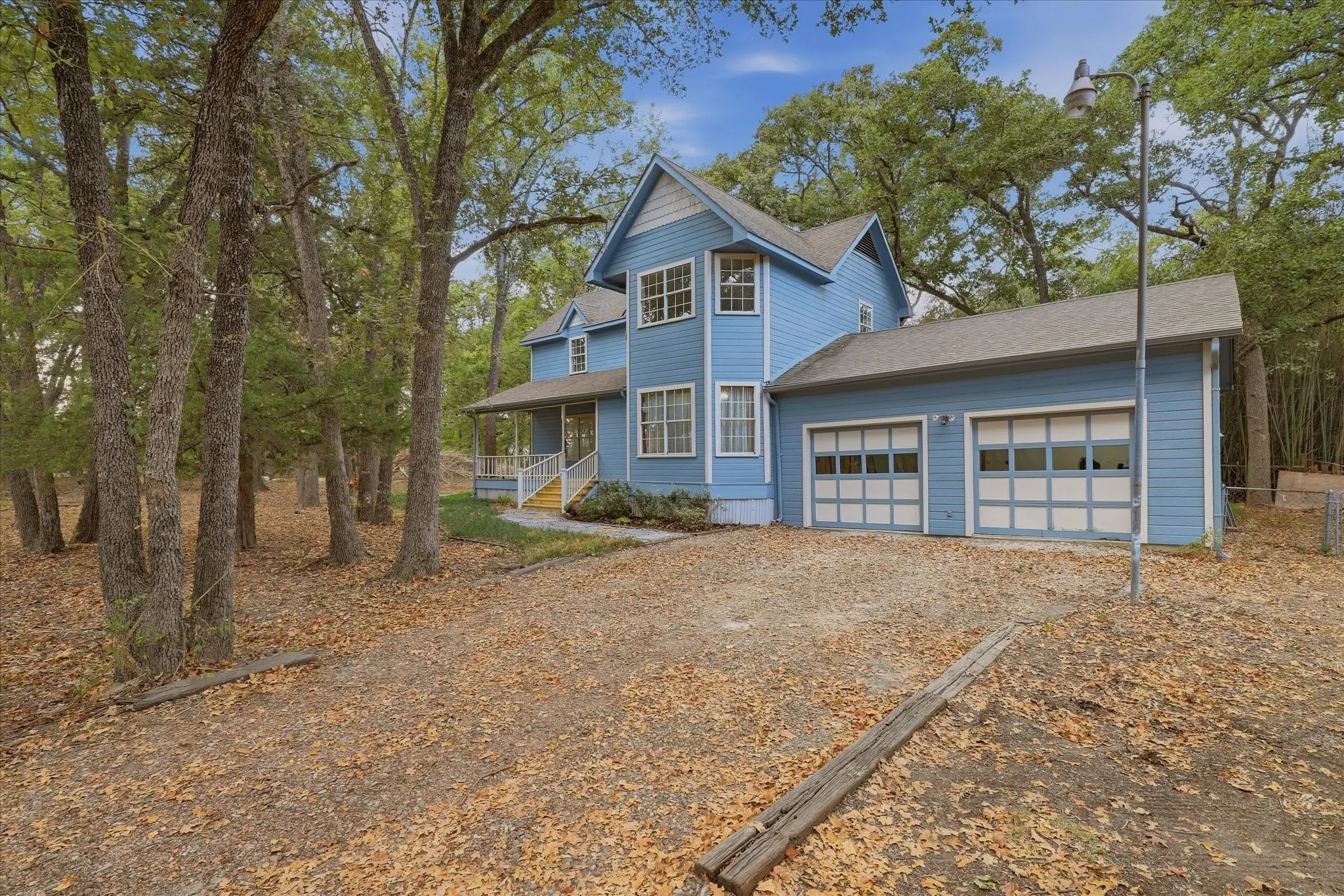 Front driveway and attached 2 car garage.