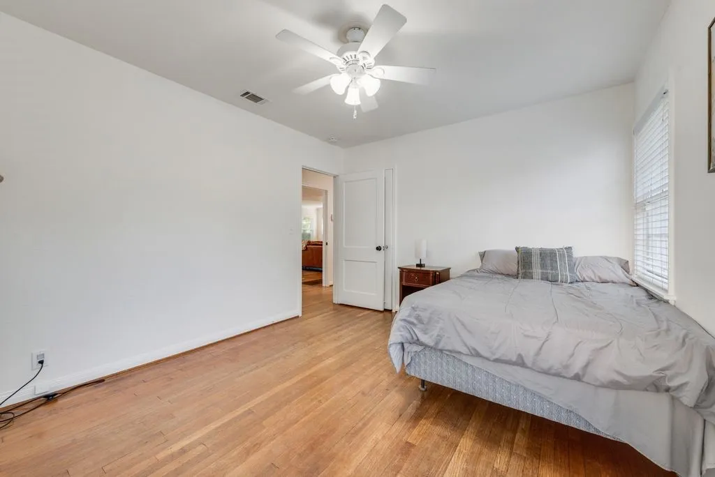 Hardwood floors and a ceiling fan keep this room comfortable and inviting all year long.