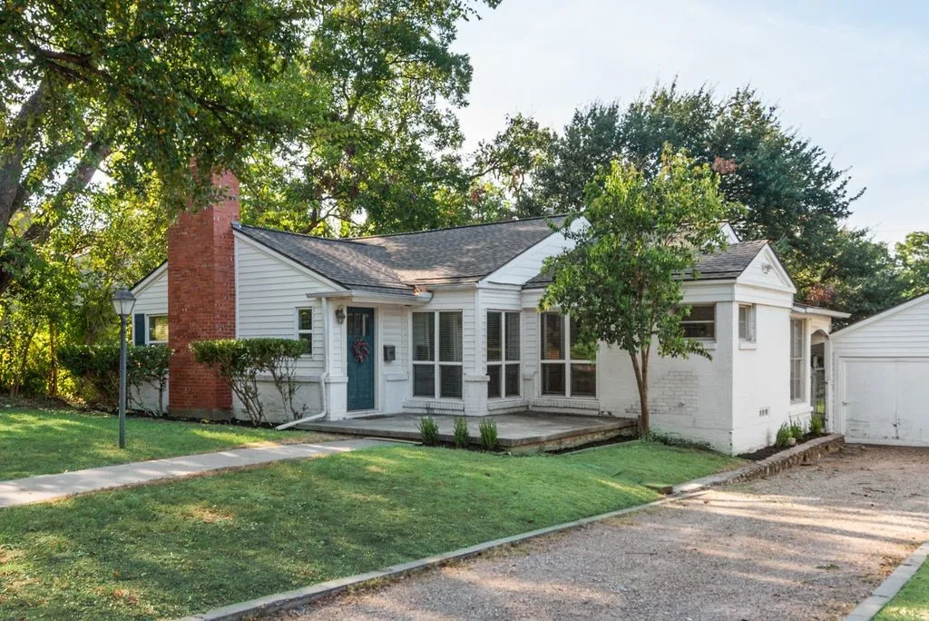 A traditional cottage style home on a quiet, tree lined street with all the charm of an established neighborhood.