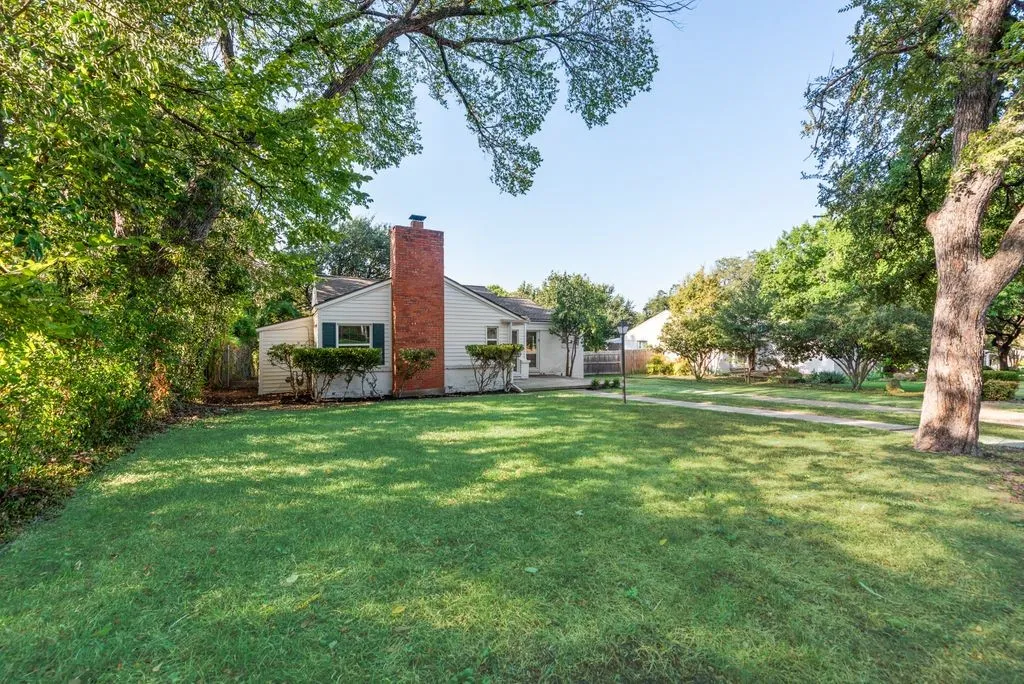 Imagine the kids running across this wide green lawn while you relax in the shade of the giant oak.