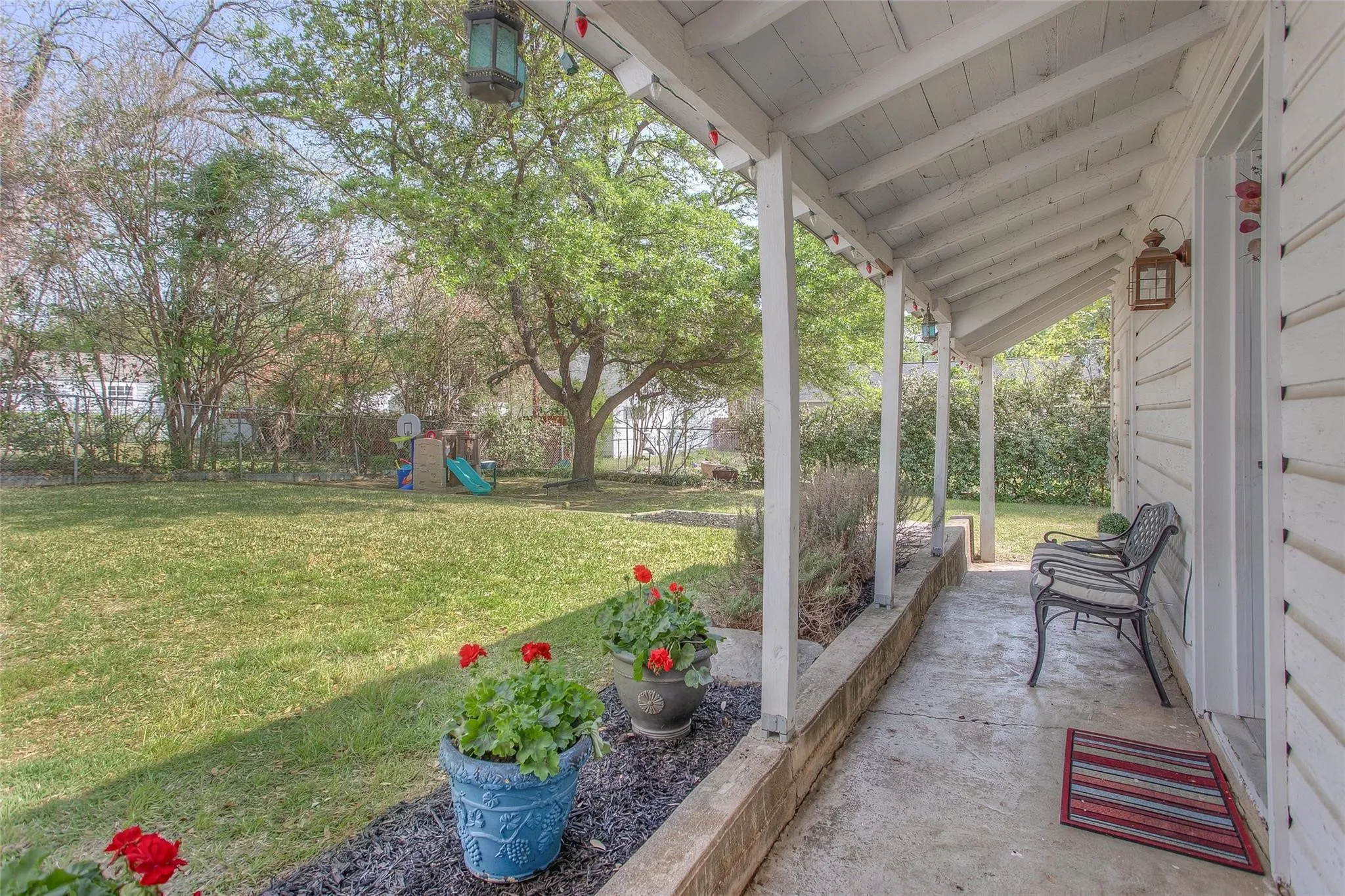 Sip your morning coffee on the porch bench and enjoy the quiet, shaded backyard.