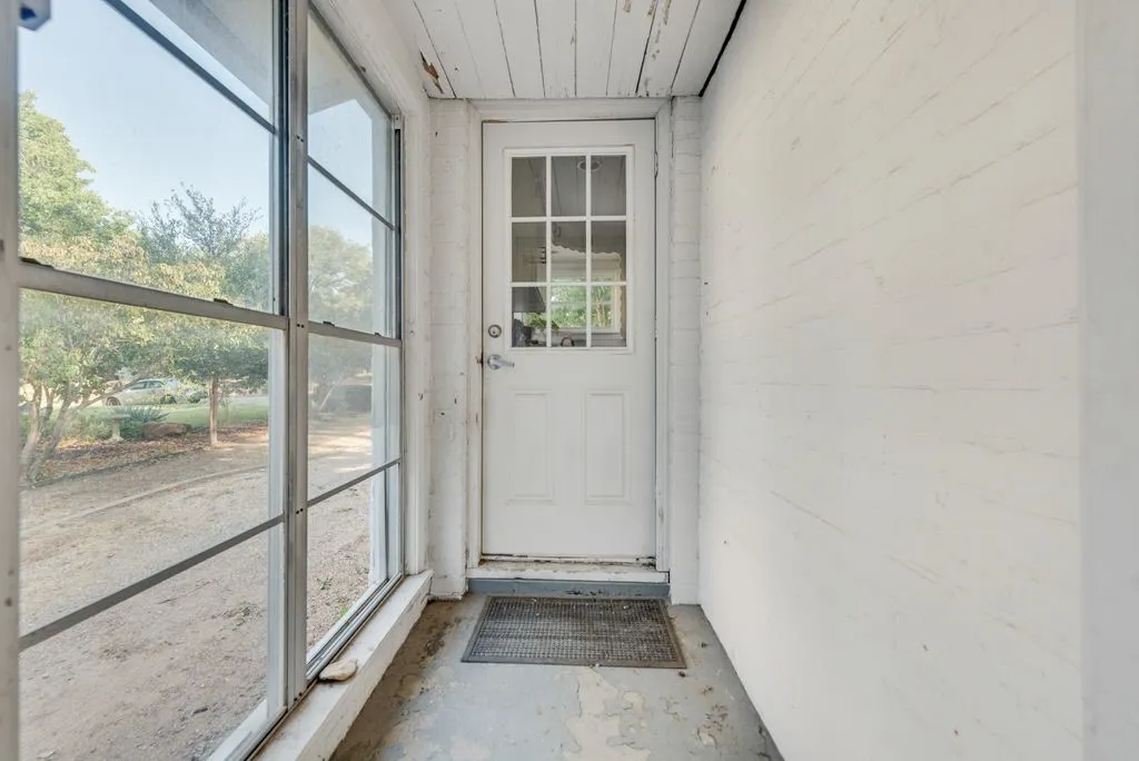 Kick off your muddy shoes in this bright side entry before heading inside.