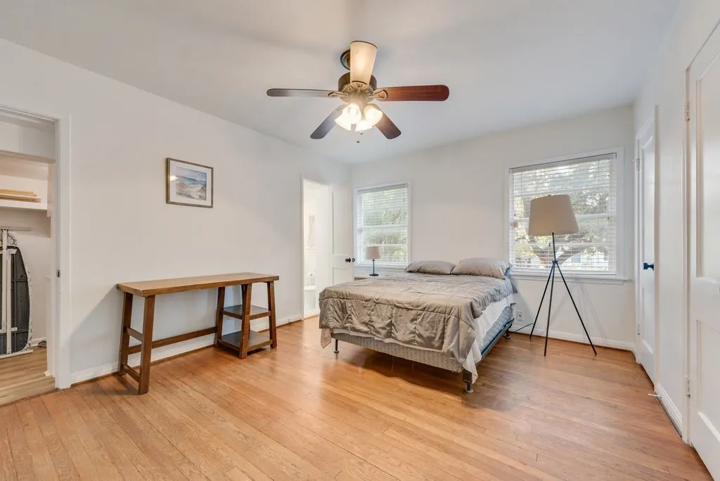 Wake up to soft morning light and treetop views in this peaceful bedroom.