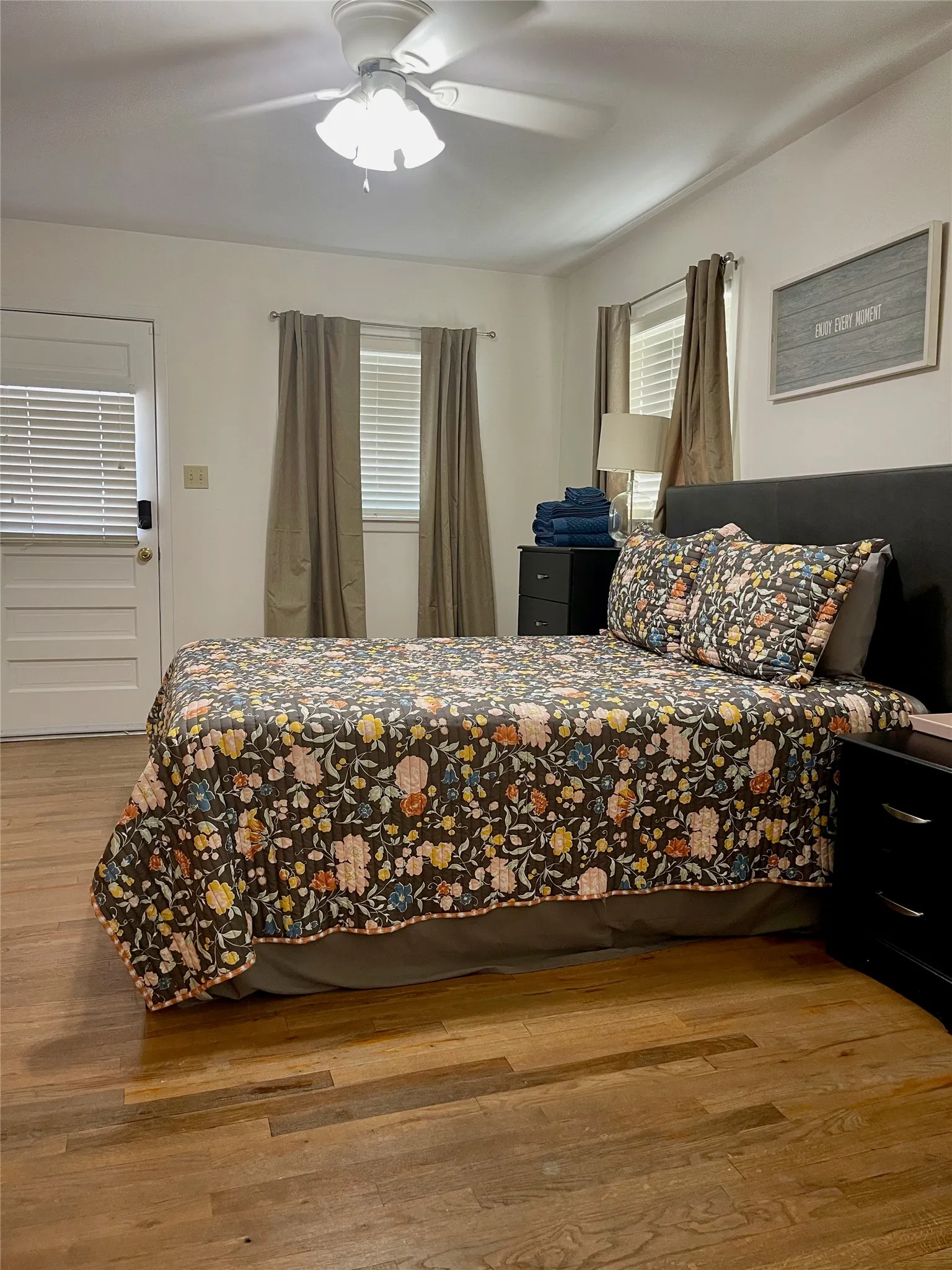 Bedroom with wood flooring and ceiling fan