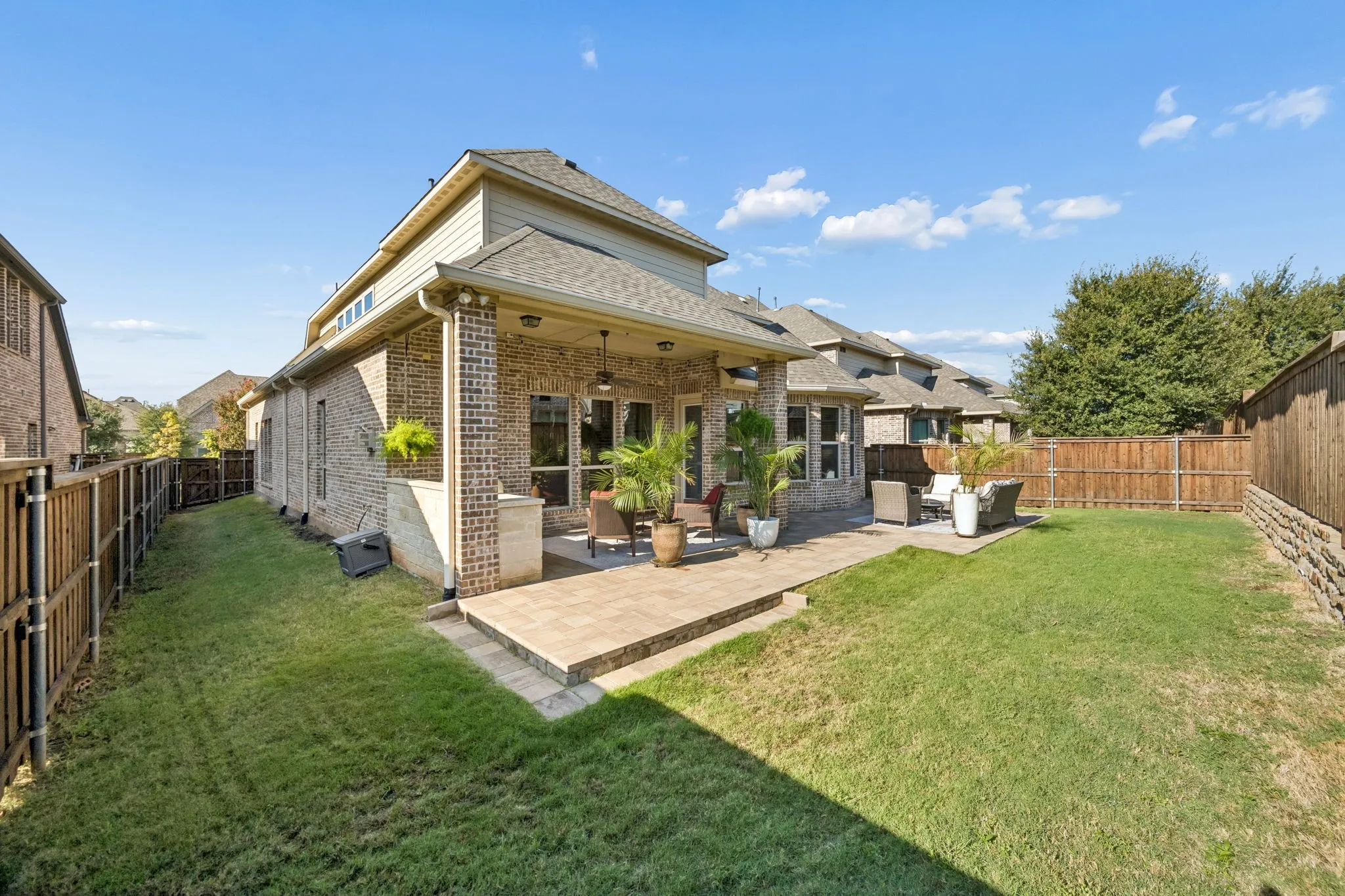Backyard with Covered & Uncovered patio + Grassy area for Pets & Play
