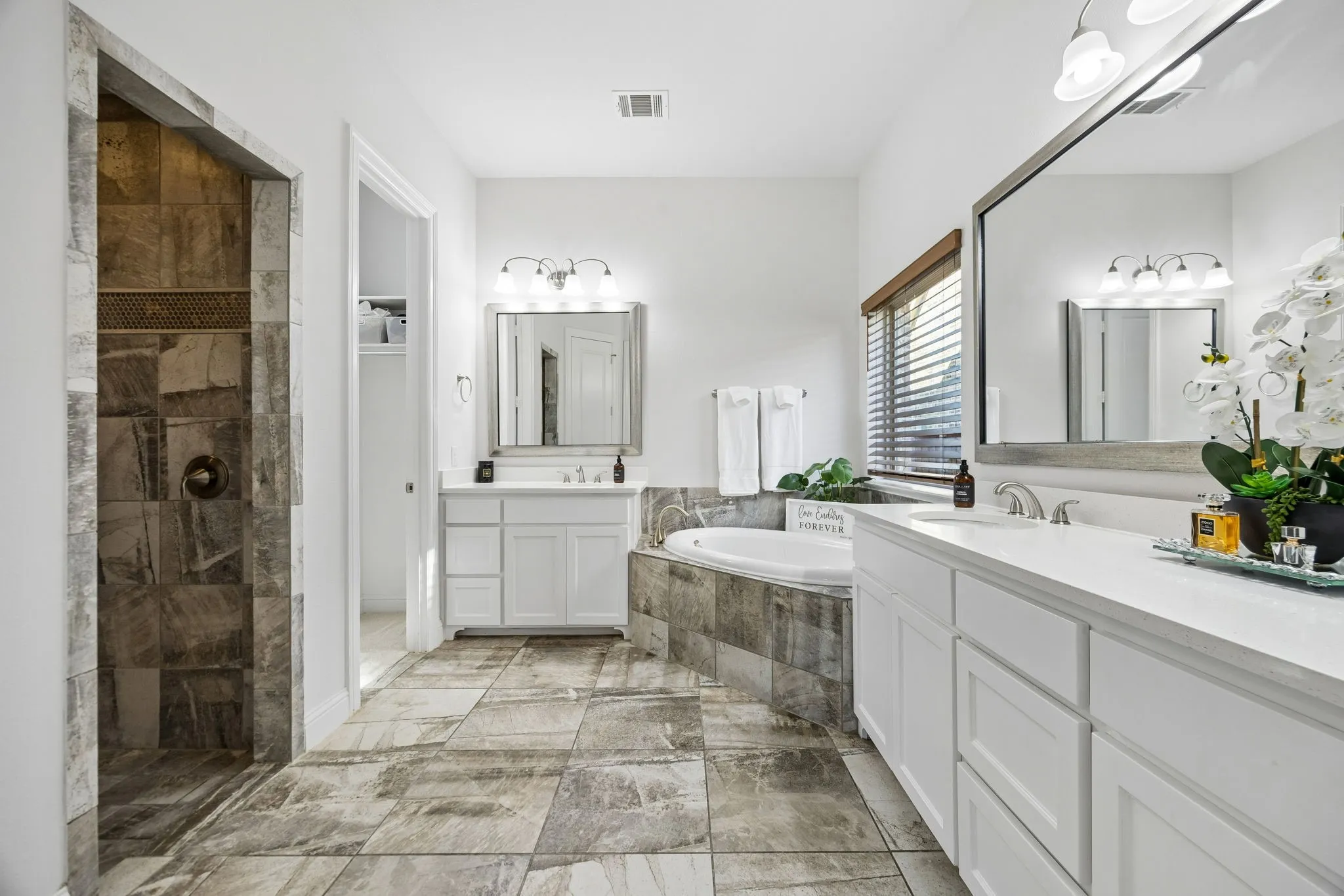 Beautiful tile step-in shower, floors and tile tub surround