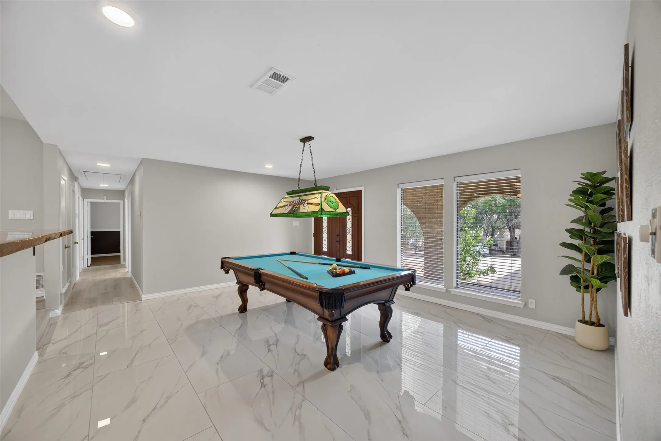 Second living area at the front of the home with a view down the hallway to the bedrooms
