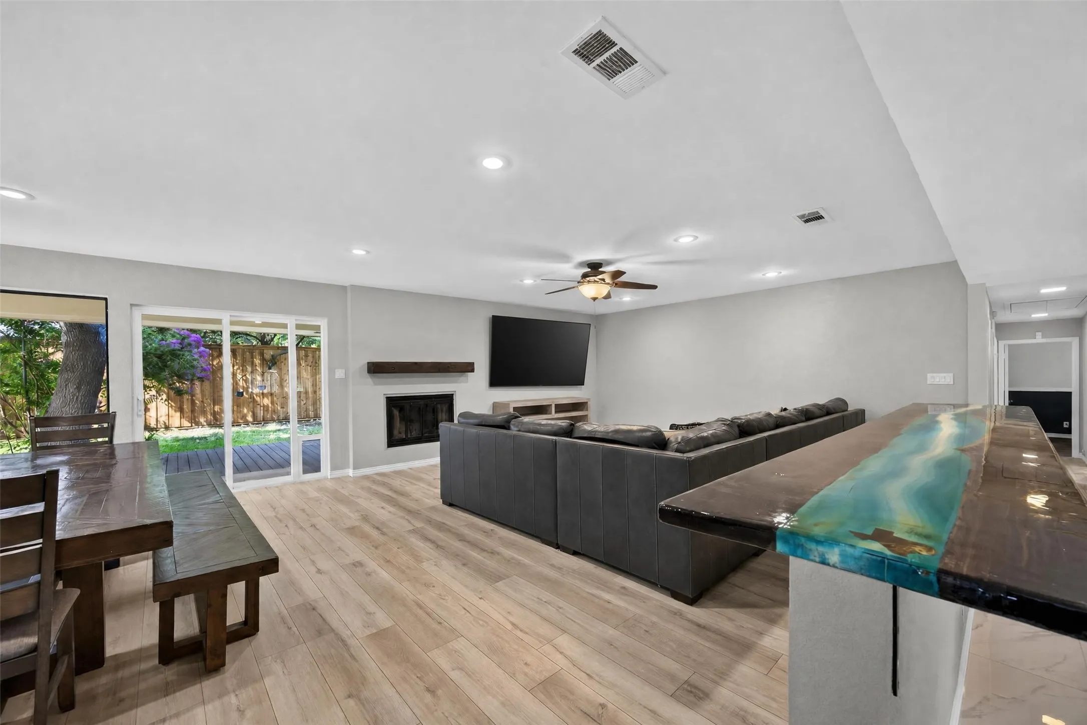 Living and dining rooms with a view of the handmade custom bar